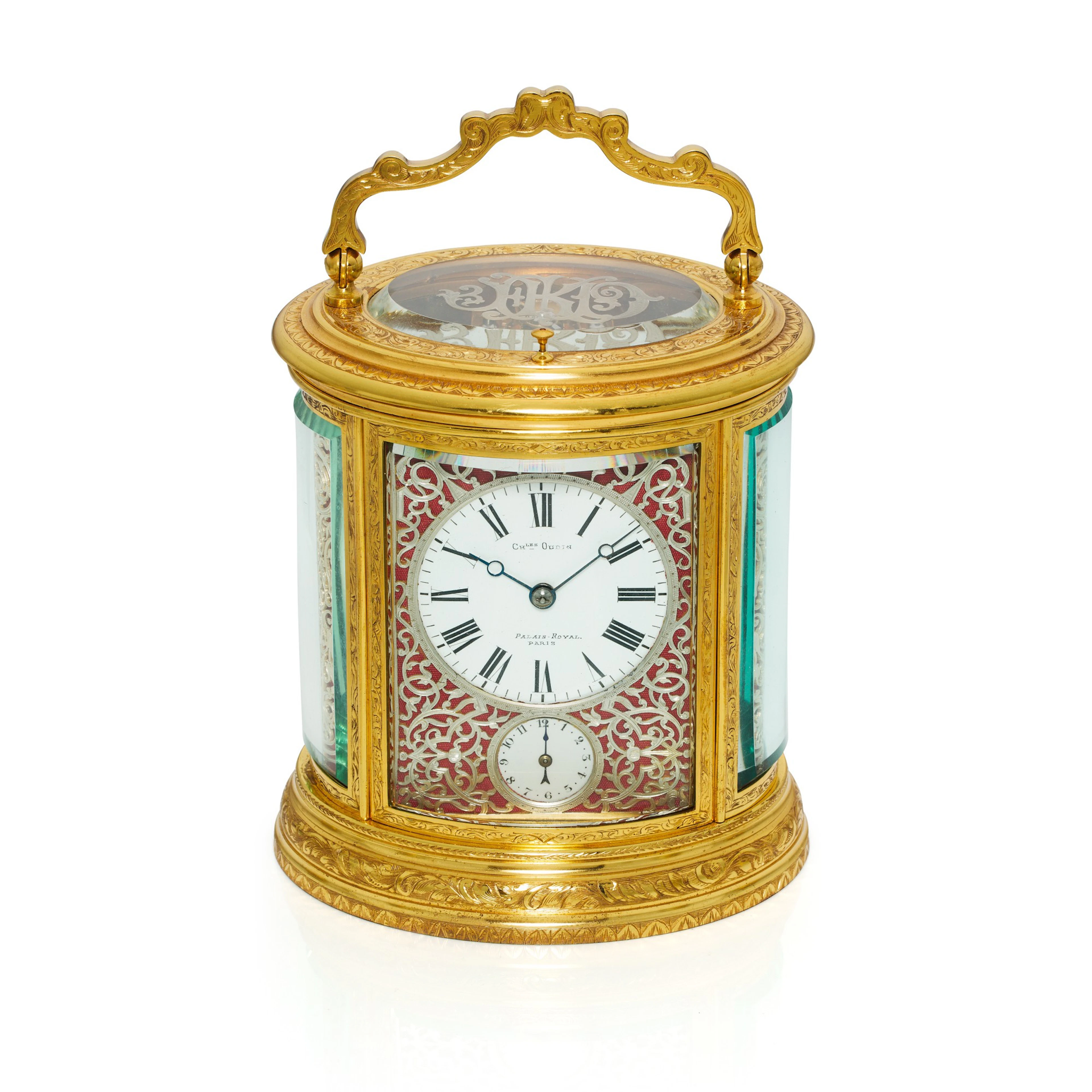 An engraved gilt-brass oval grande sonnerie repeating alarm carriage clock