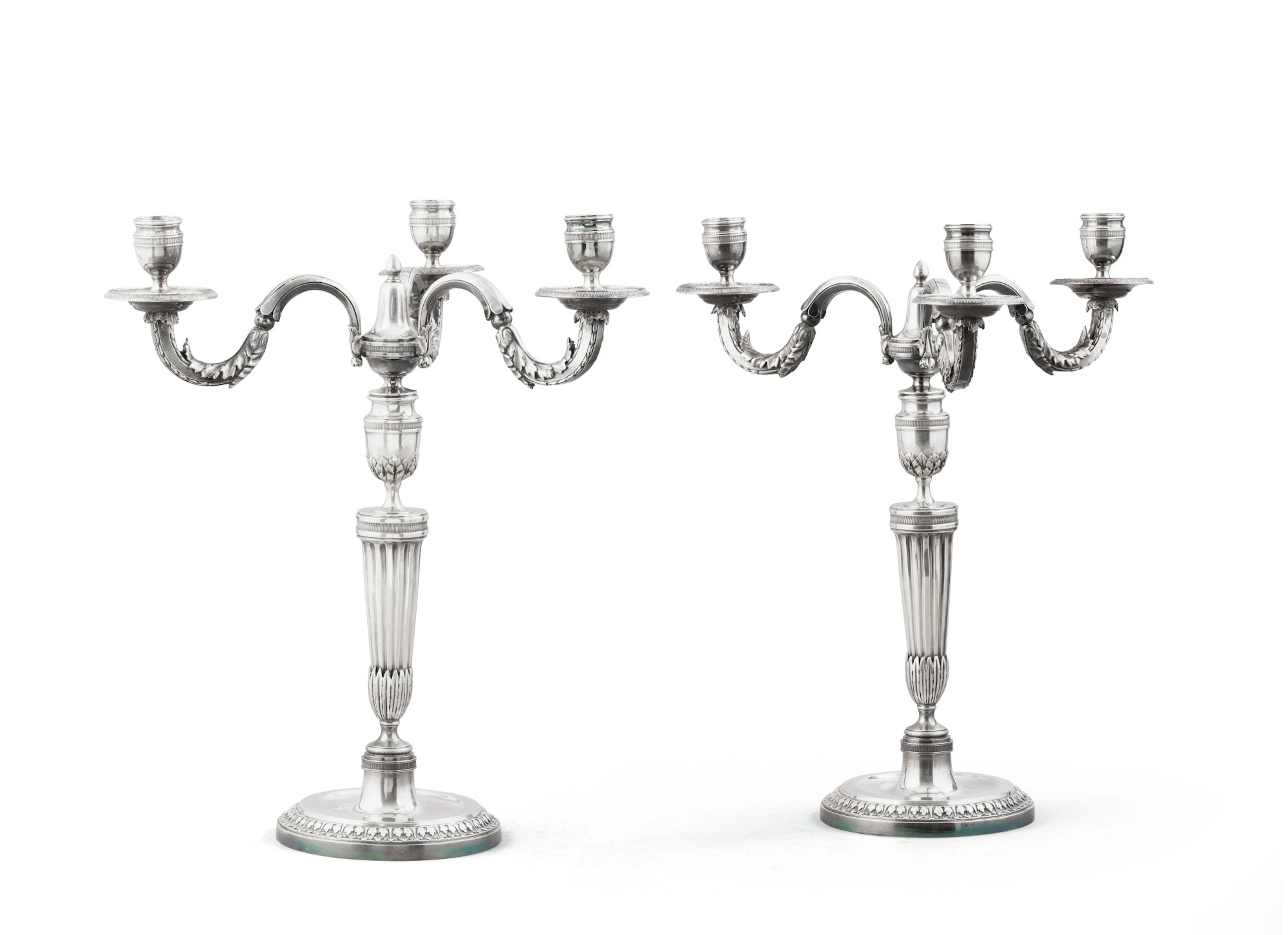 A pair of French silver three-light candelabra