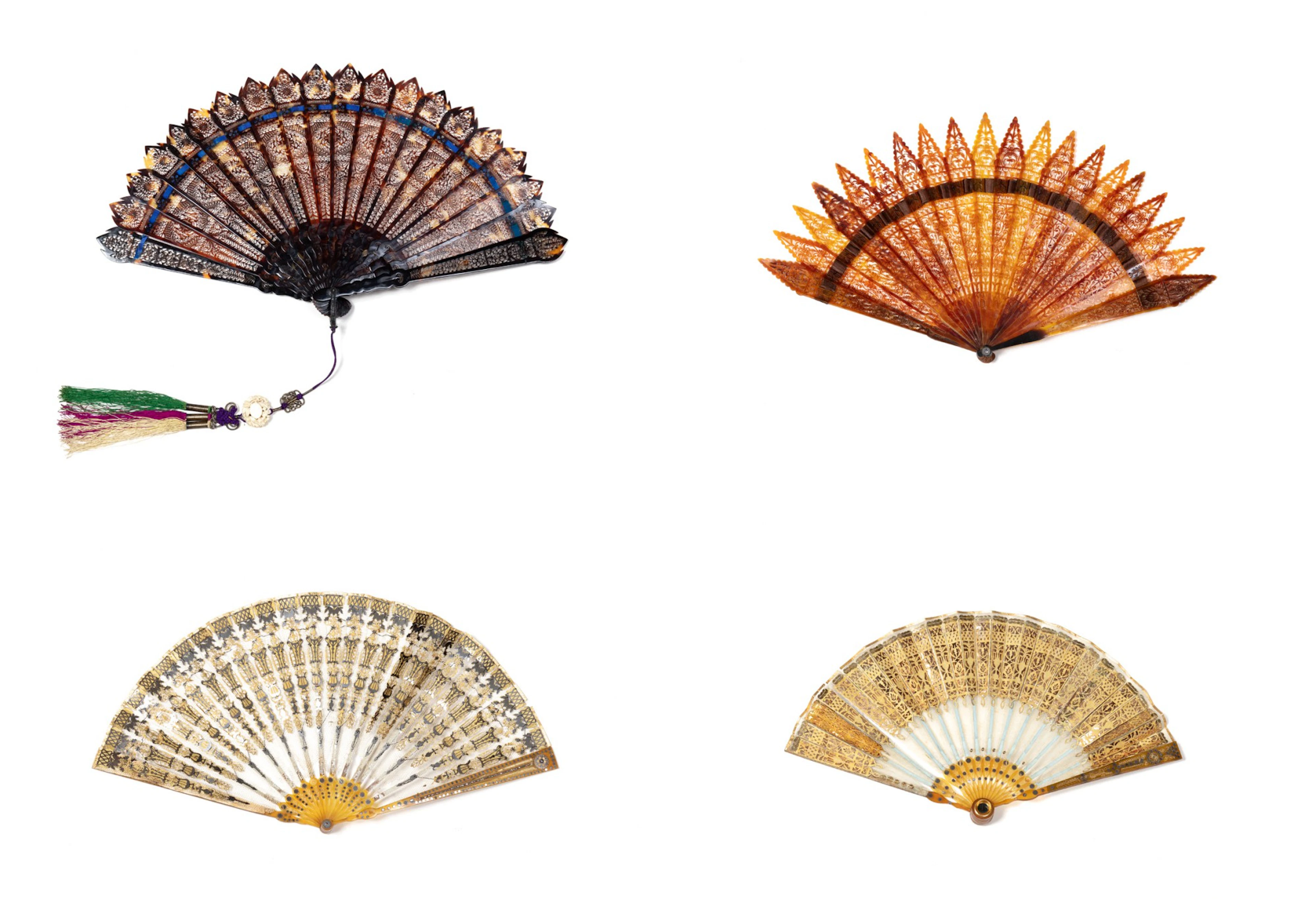 A group of four various brisé fans