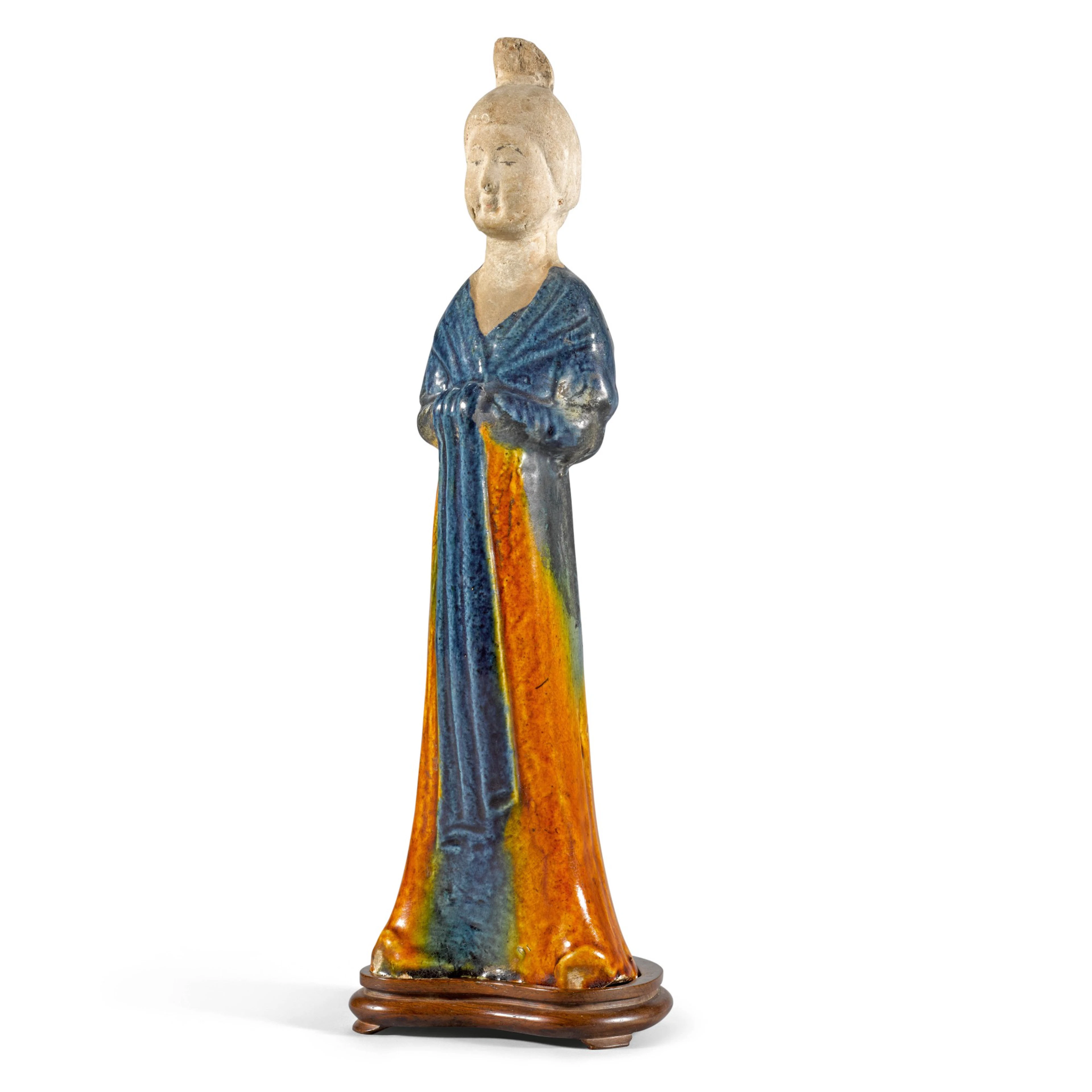 A rare and beautifully modelled blue and amber-glazed...
