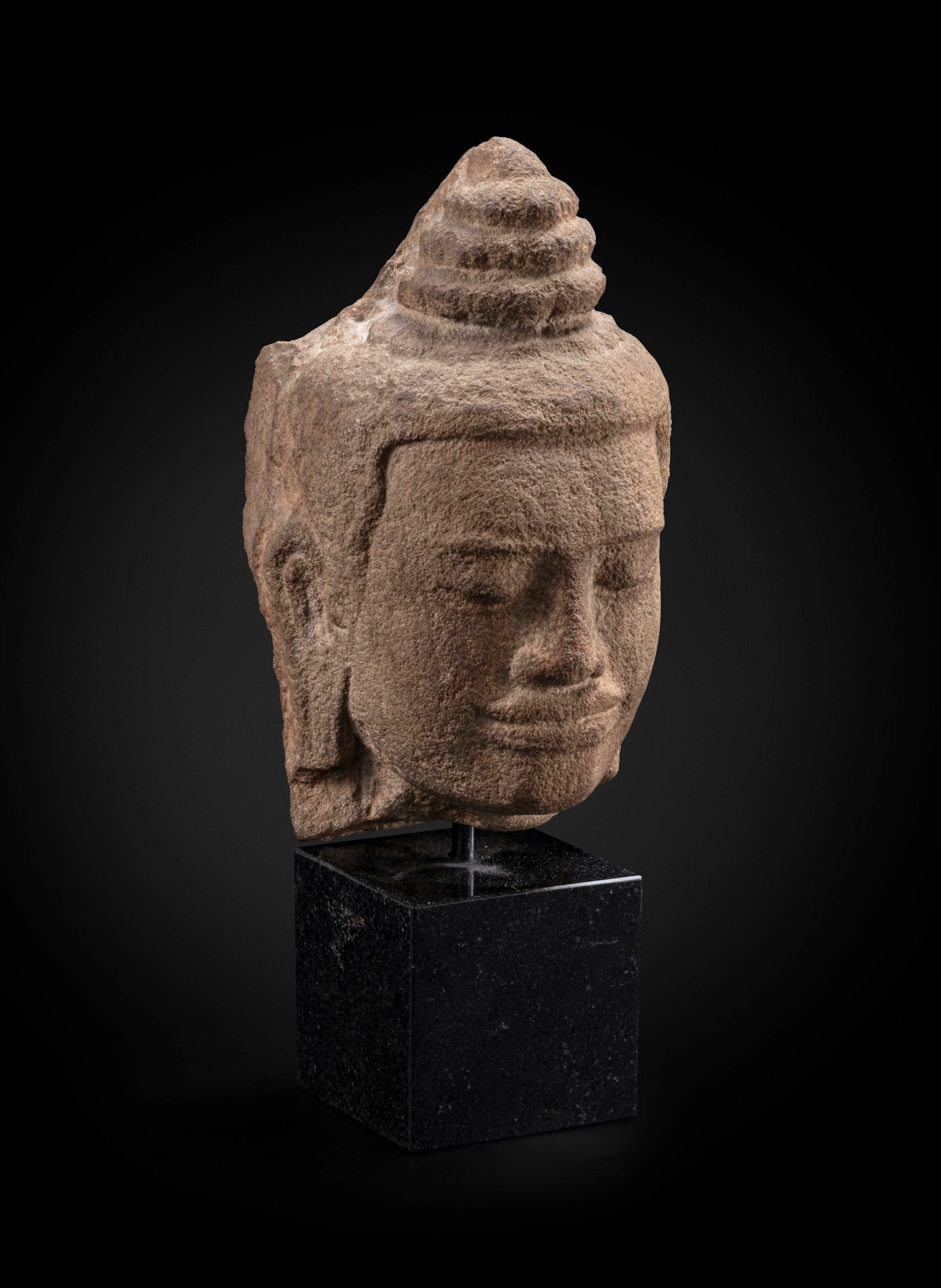 A grey sandstone head of a divinity Khmer