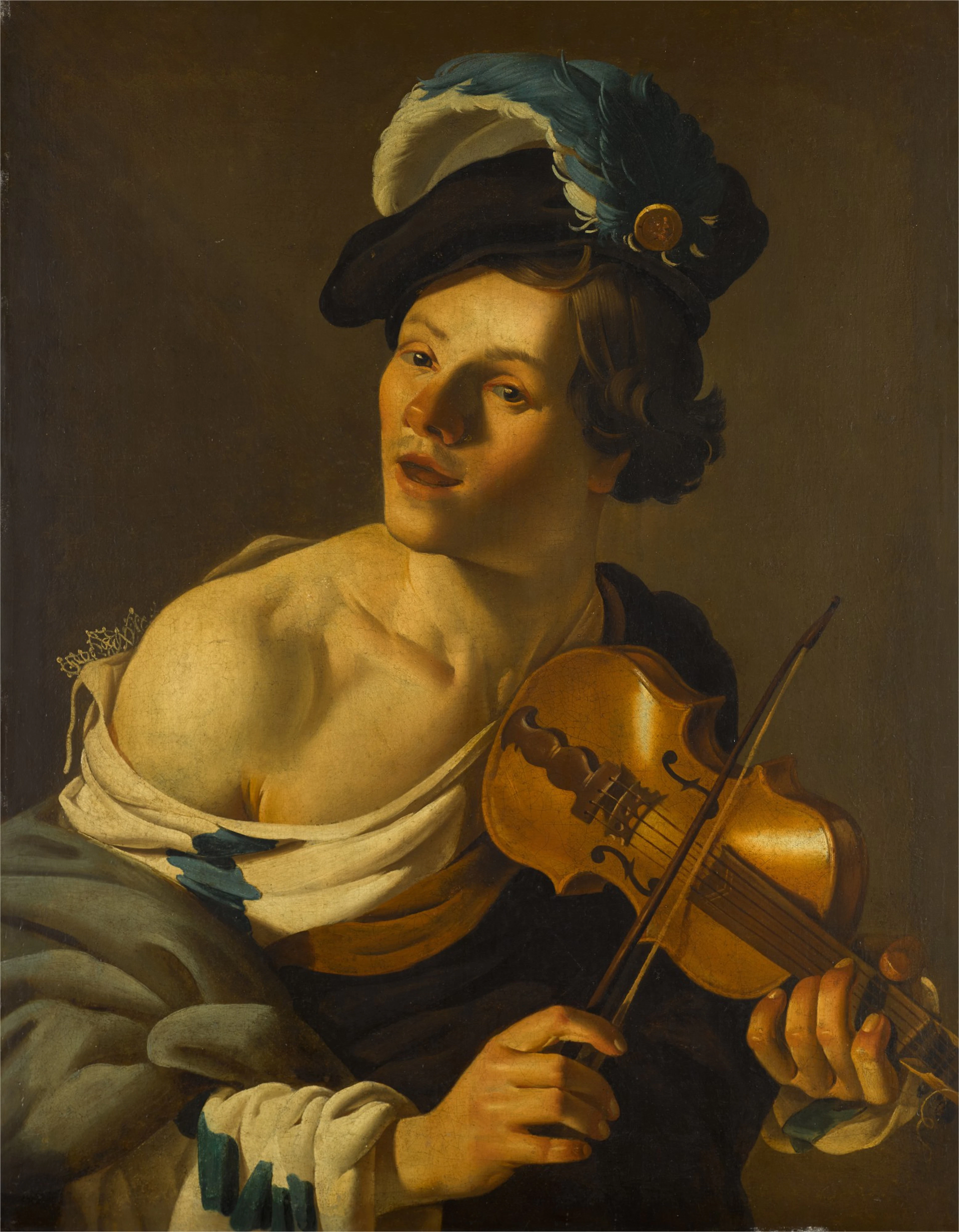 A young man playing the violi