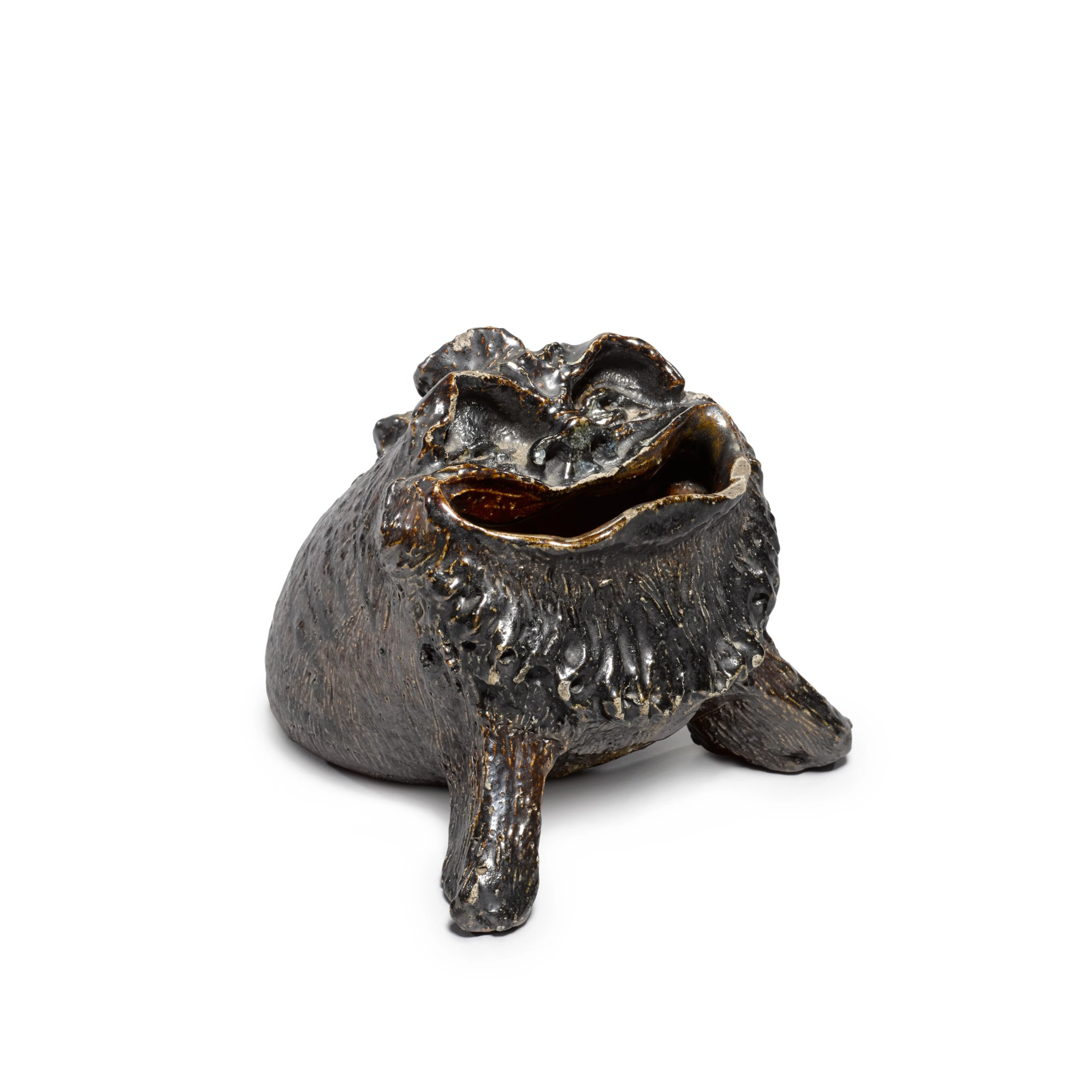 A Martin Brothers stoneware grotesque spoon-warmer, 1881