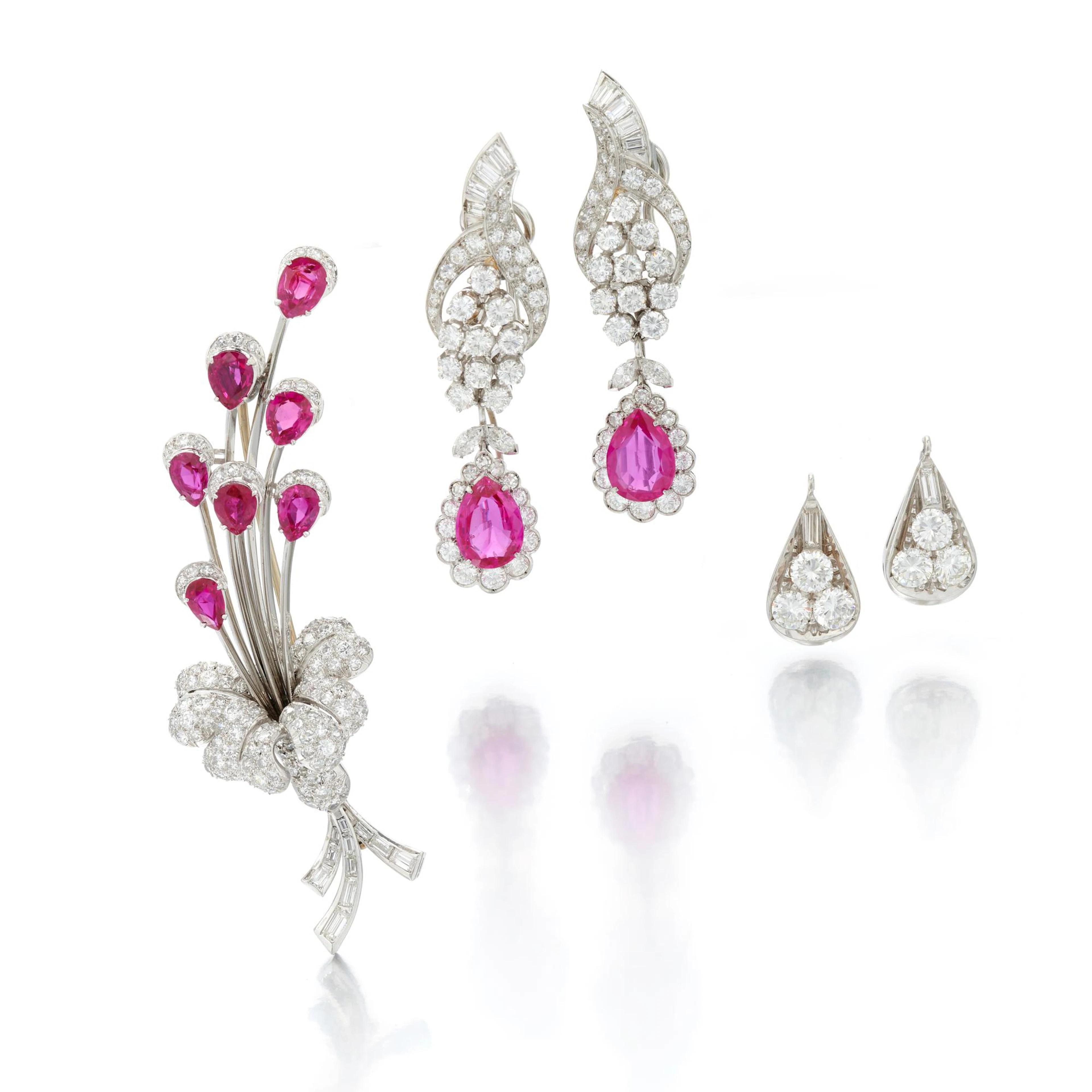 Pair of ruby and diamond earrings and a ruby and diamond...