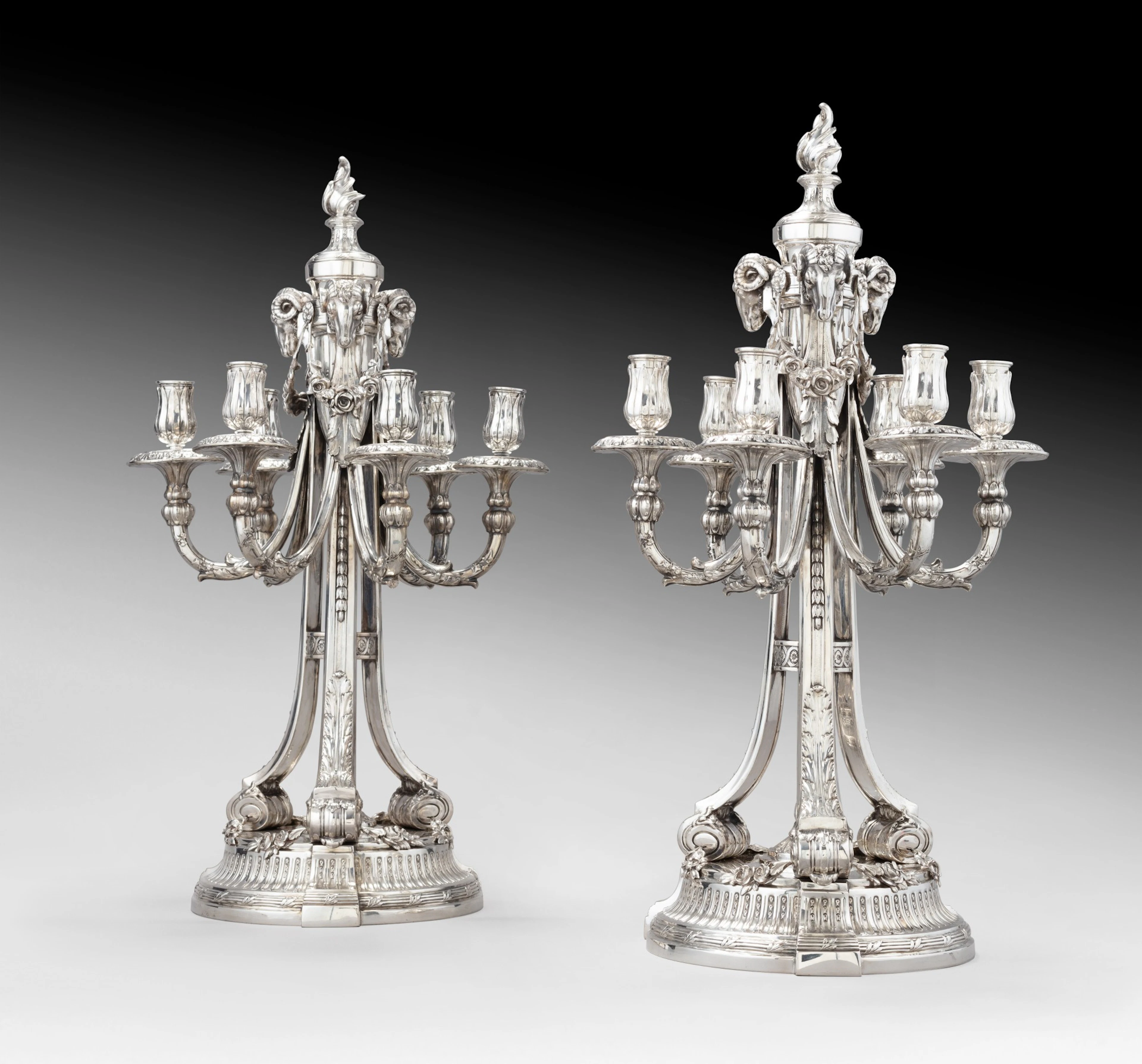 A pair of large Louis XVI style silver six-light candelabra