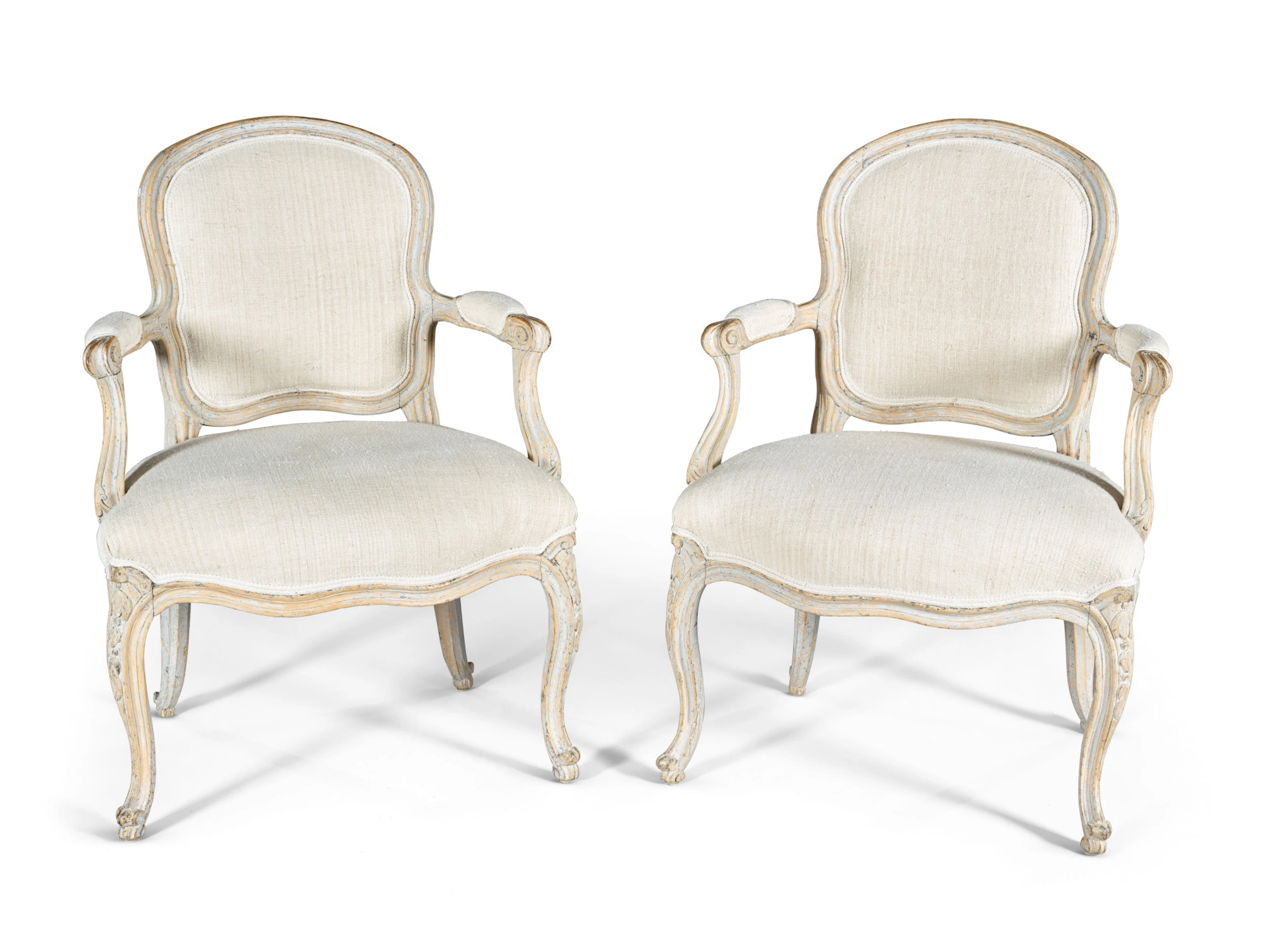 A pair of Swedish painted and carved fauteuils à la Reine, mid-18th century