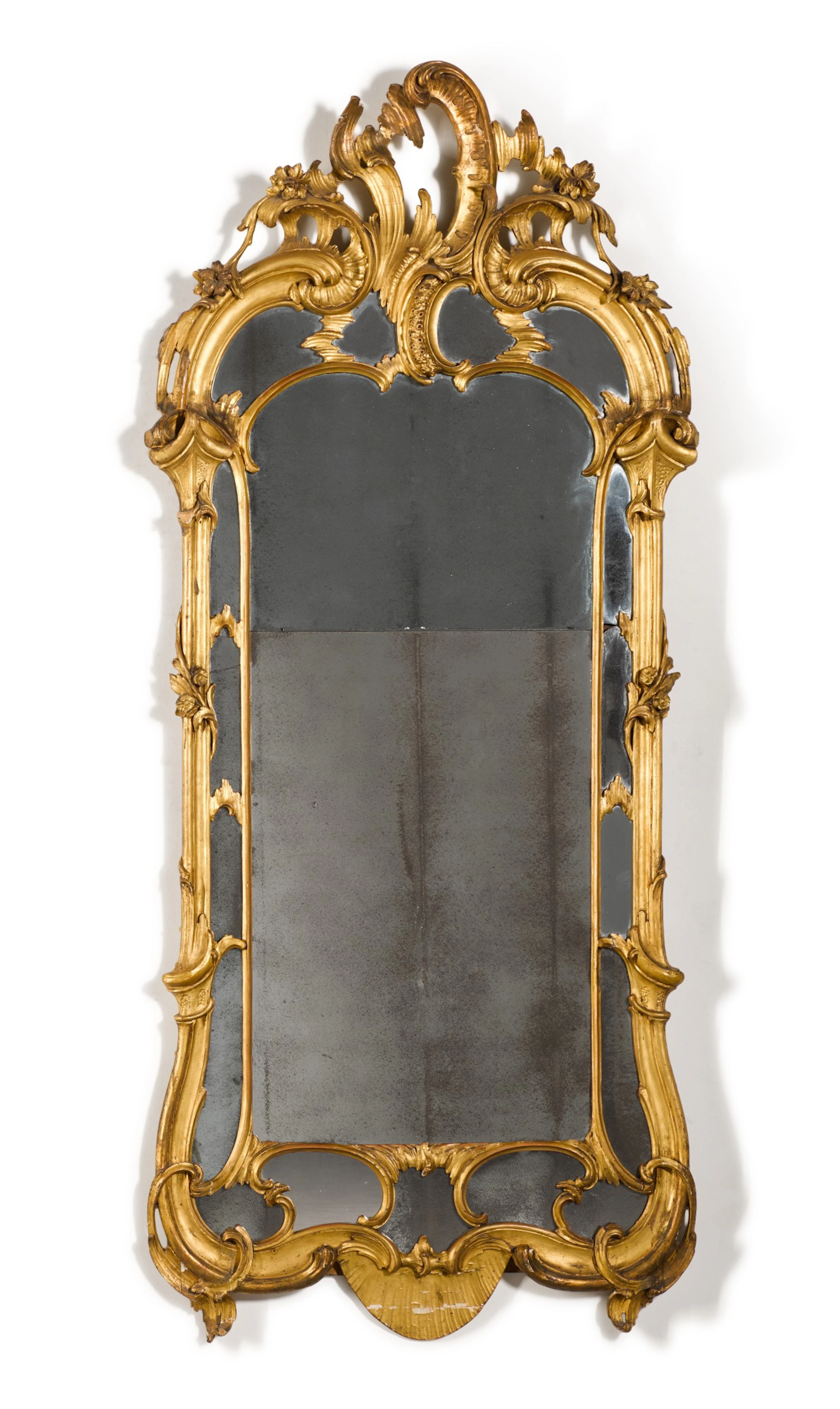 A German carved giltwood mirror, third quarter 18th century