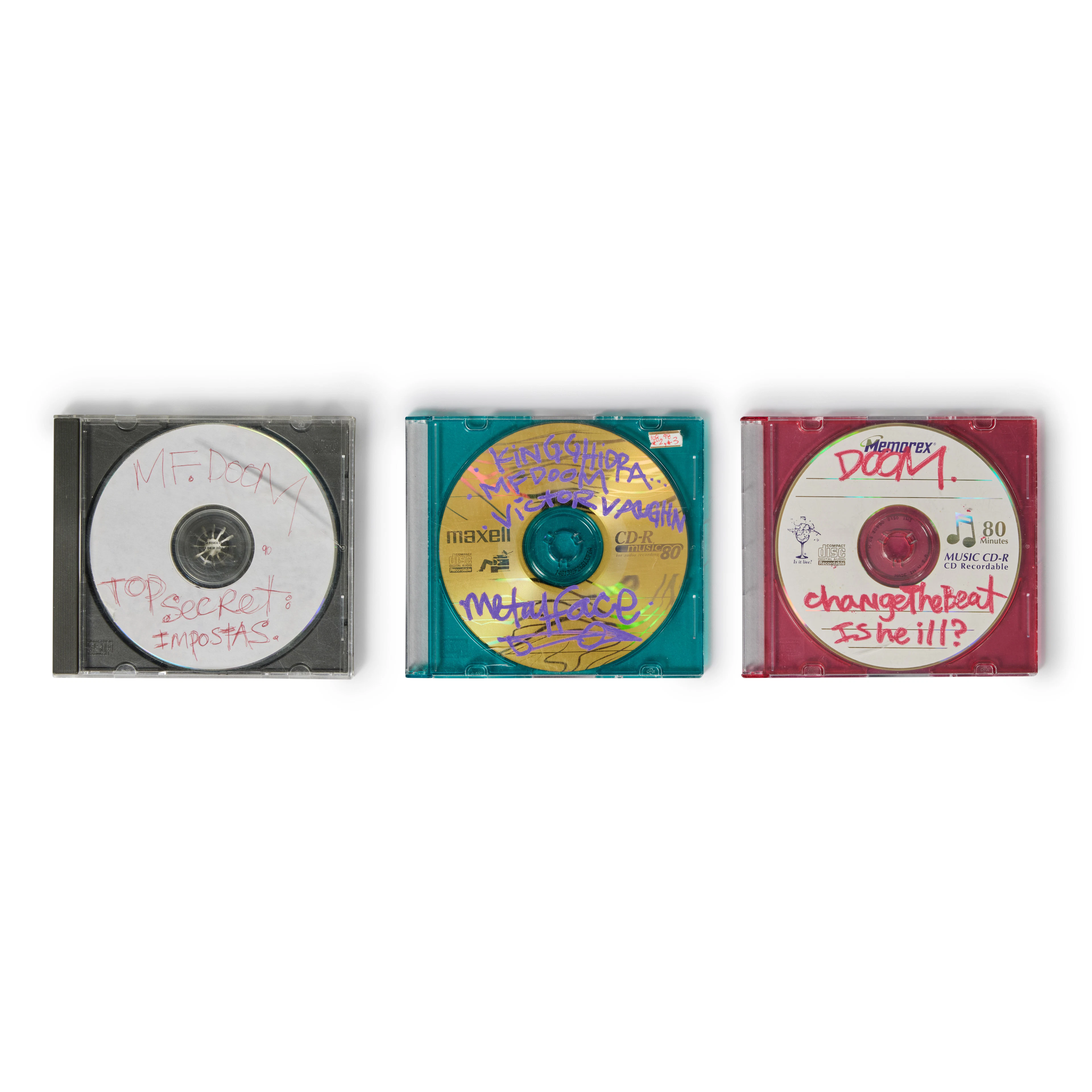Three MF DOOM demo CD-Rs, hand-labeled by MF DOOM