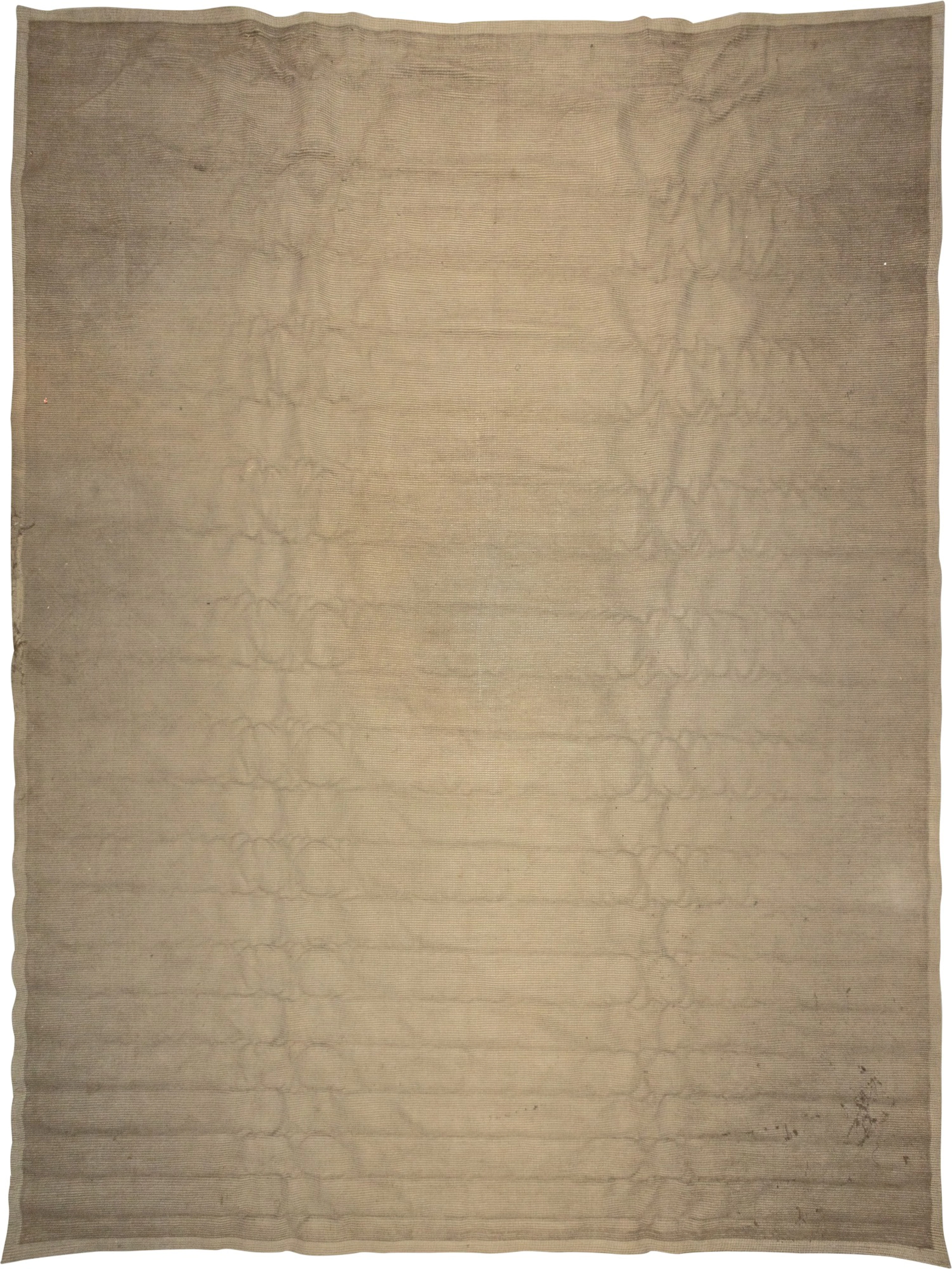 A greyish braided wool carpet | Teppich in grau-geflochtener Wolle