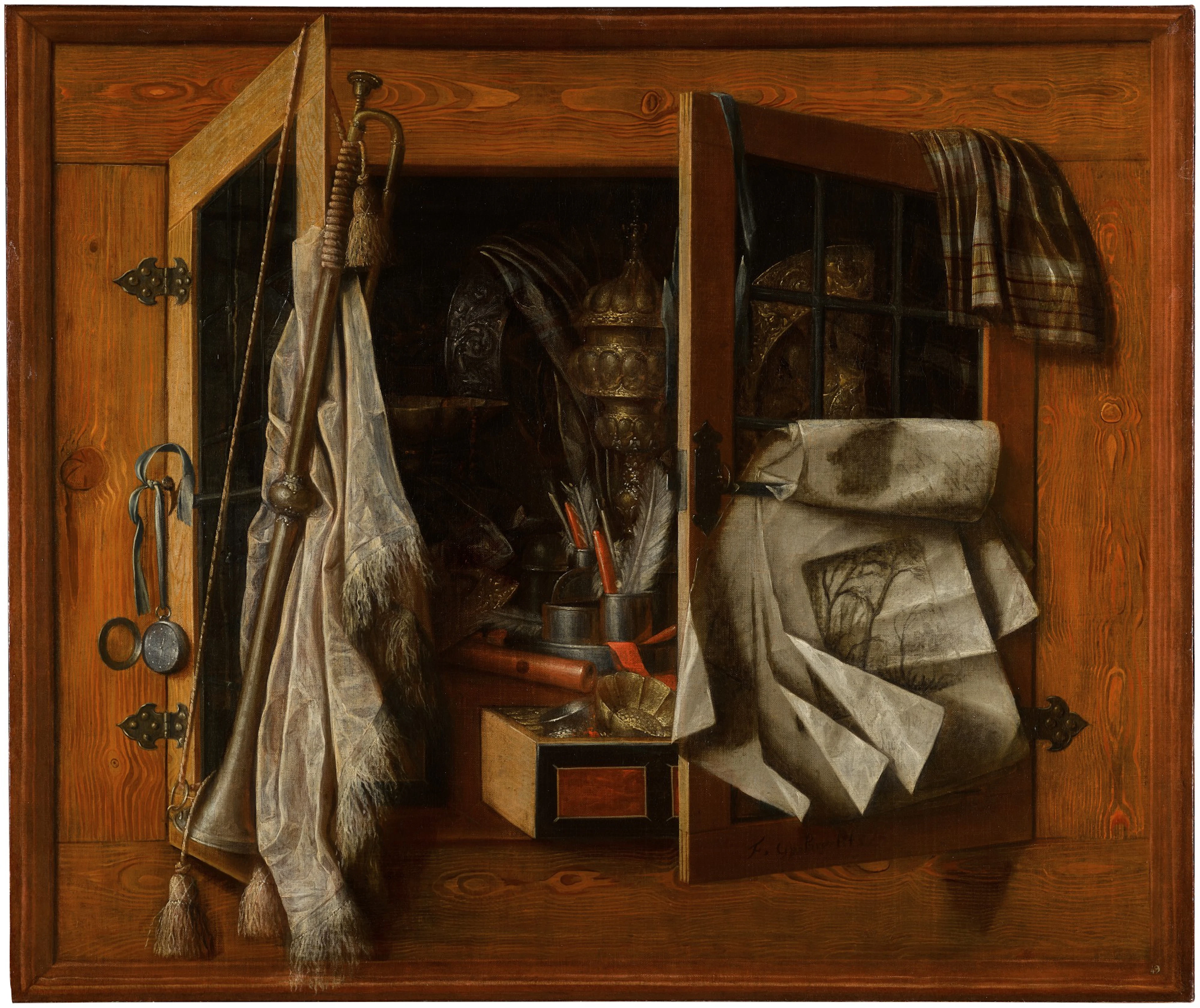 A trompe-l’œil still life of a half-open cupboard with gilded vessels