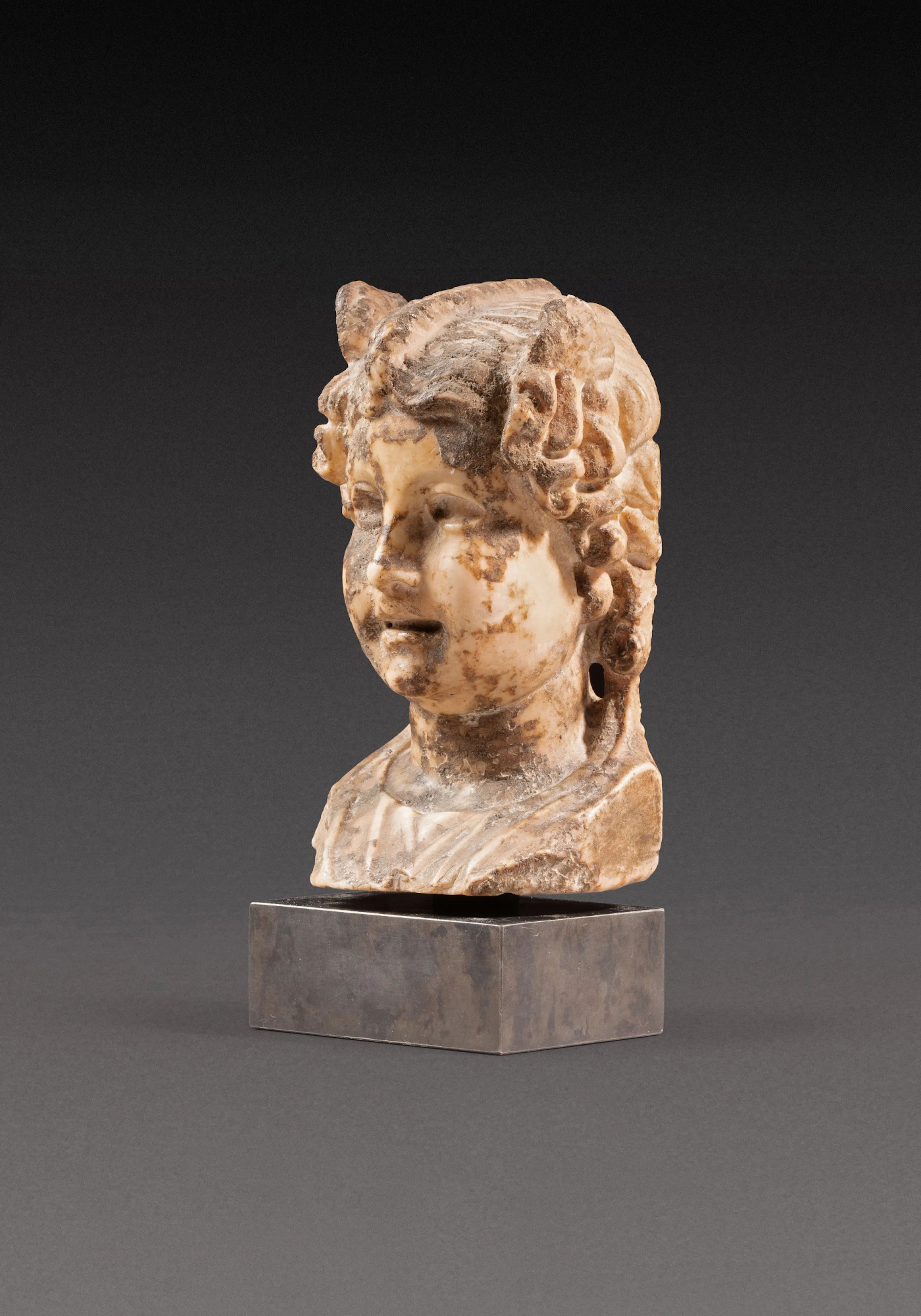 A Roman Giallo Antico Marble Herm Bust of Eros, circa 1st Century A.D.