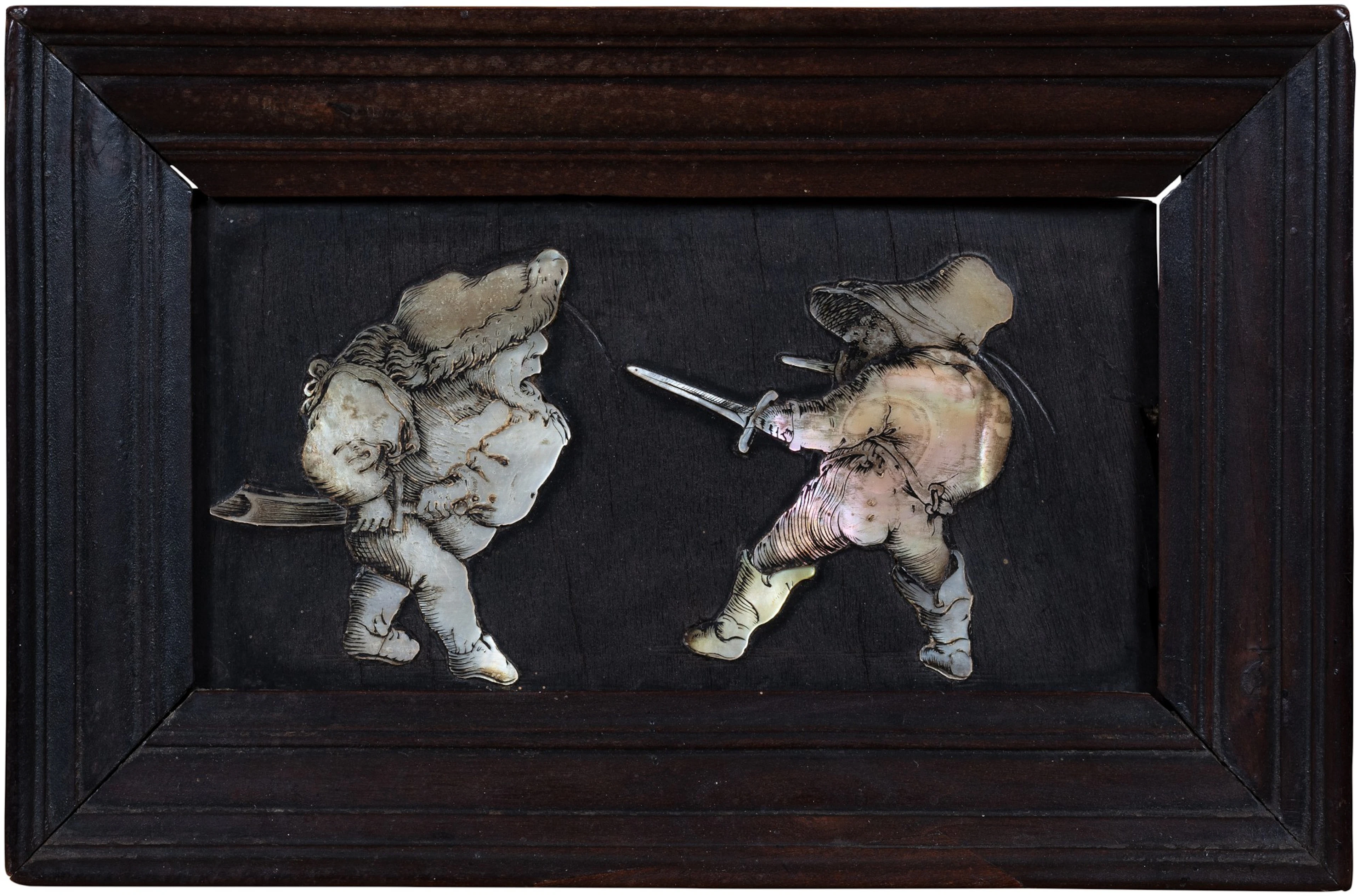 A mother-of-pearl and blackened wood plaque