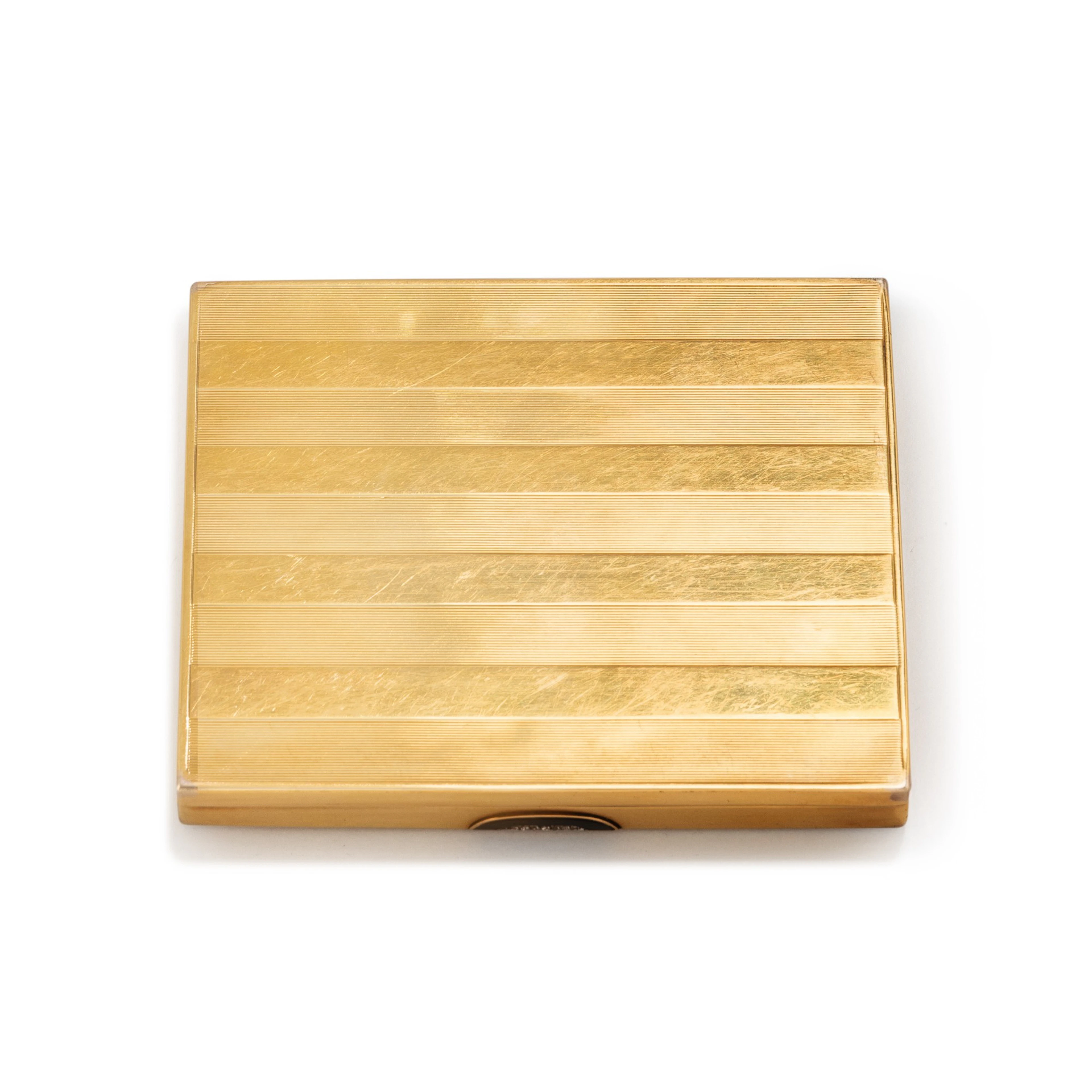 A jewelled gold cigarette case