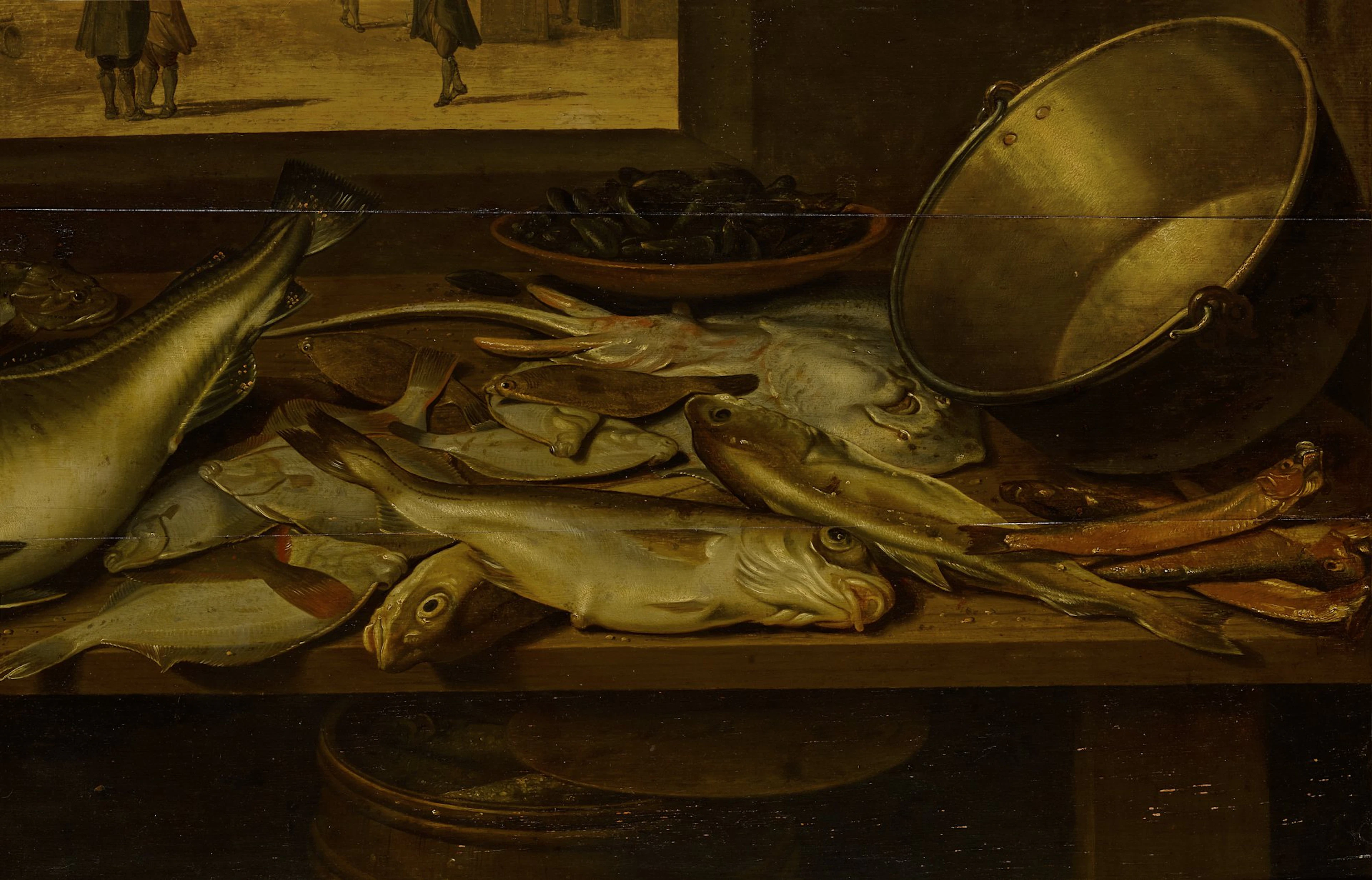 Assortment of fish with a bowl of mussels and a copper pot on a wooden table