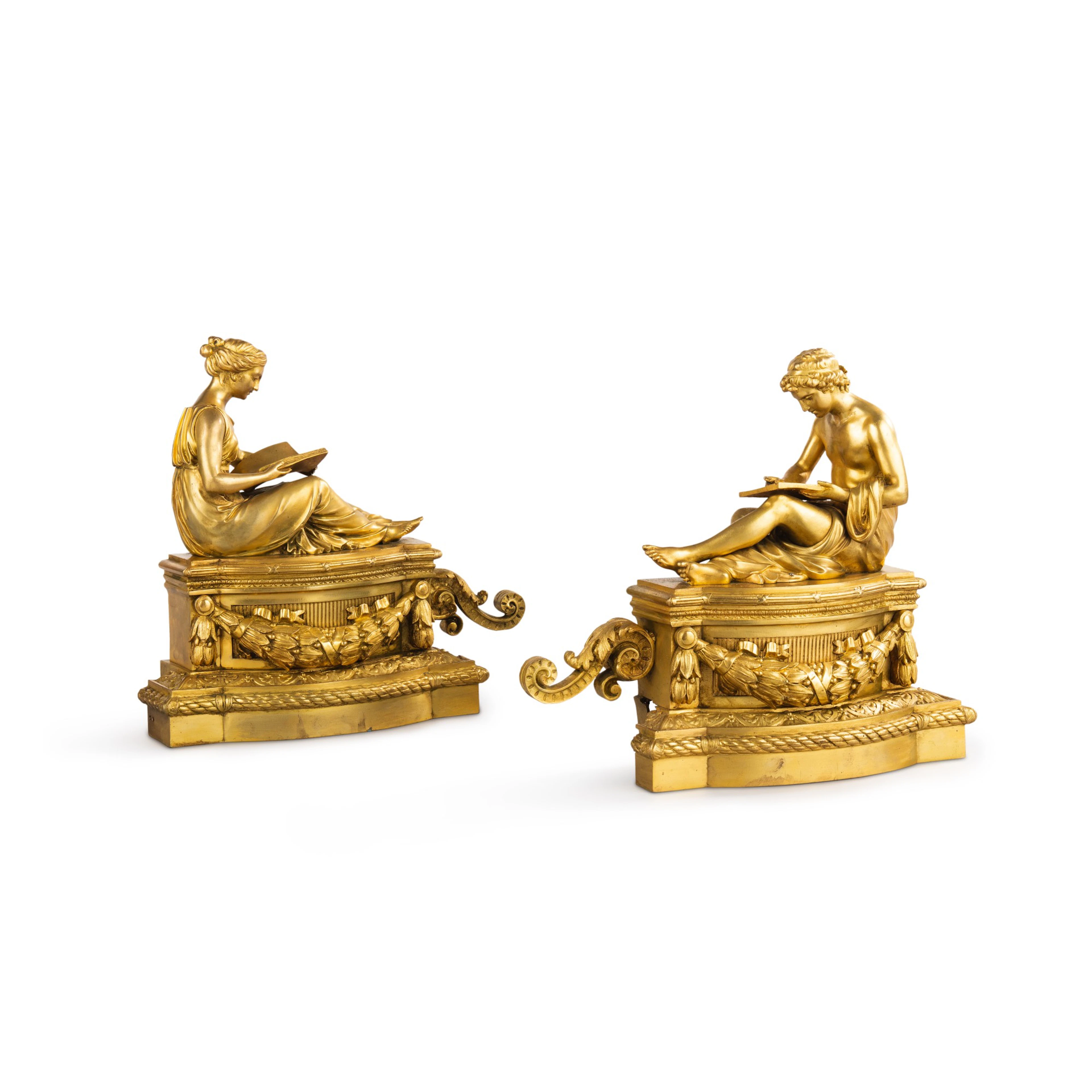 A pair of large Louis XVI style gilt-bronze chenets, 19th century