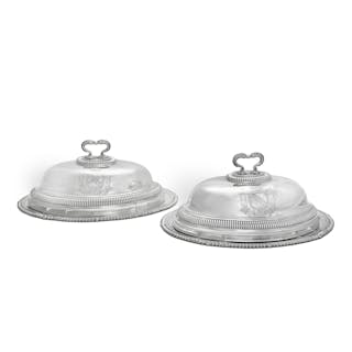 A pair of George III silver meat dishes and covers