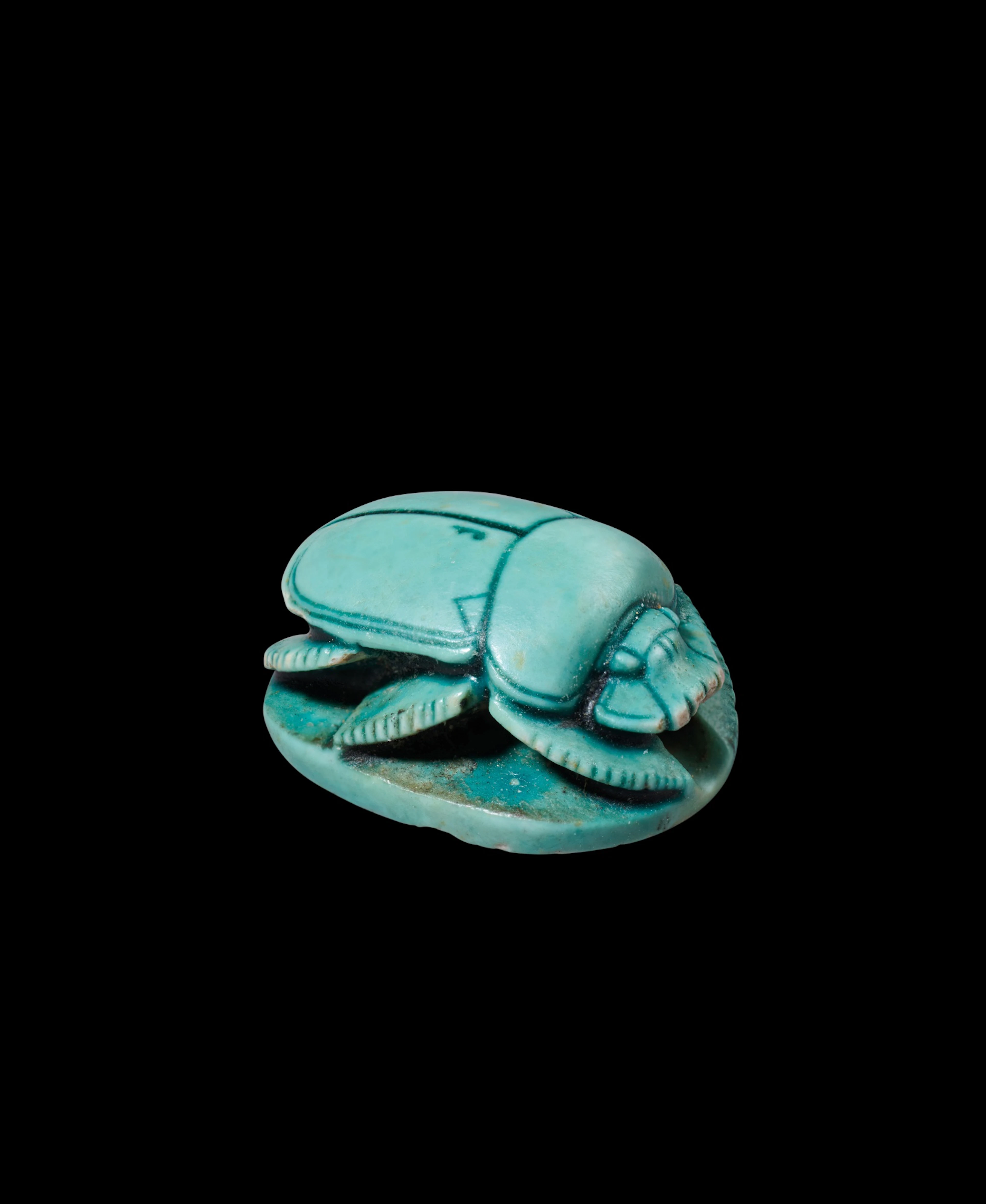 An Egyptian Turquoise-glazed Steatite Scarab