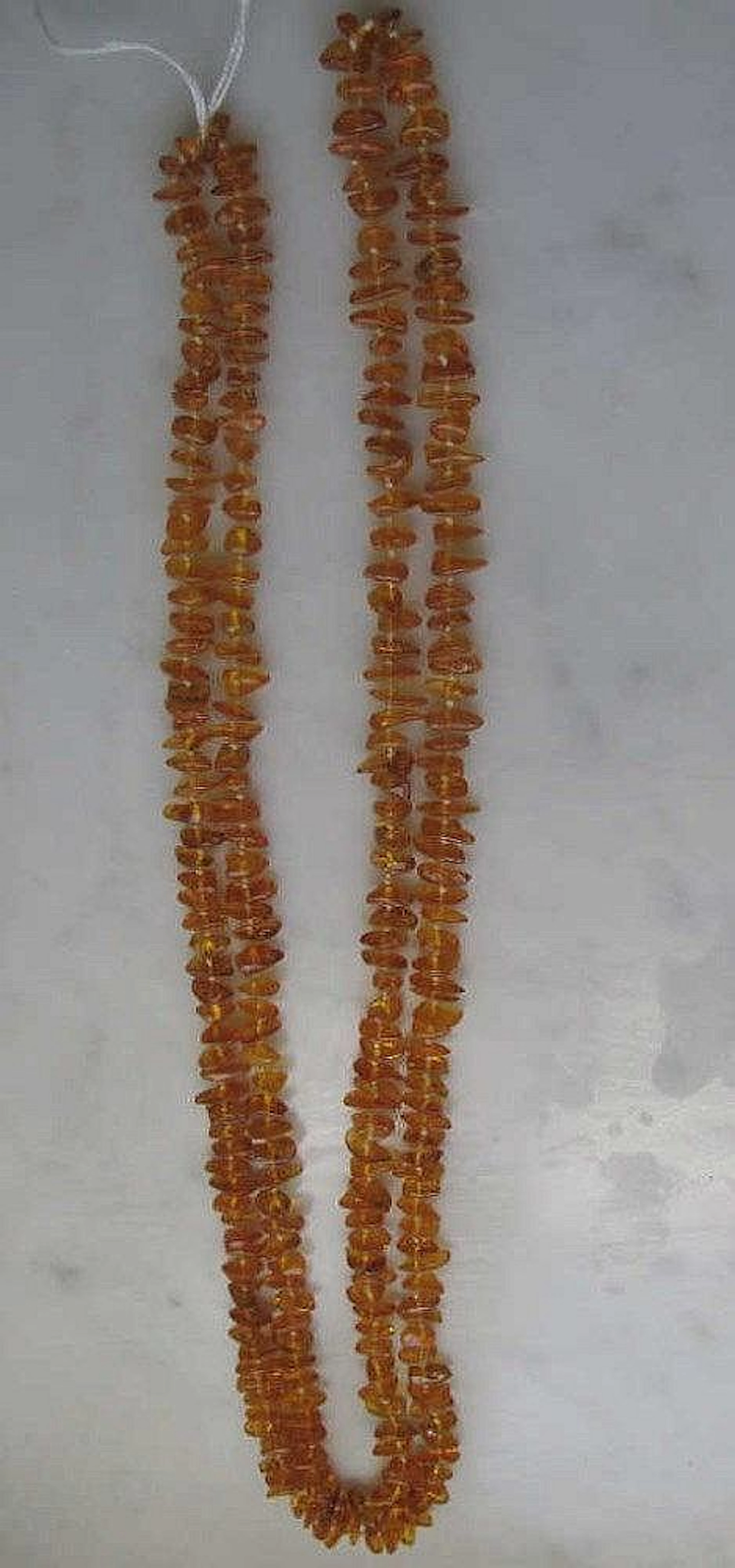 Golden amber opera length bead necklace