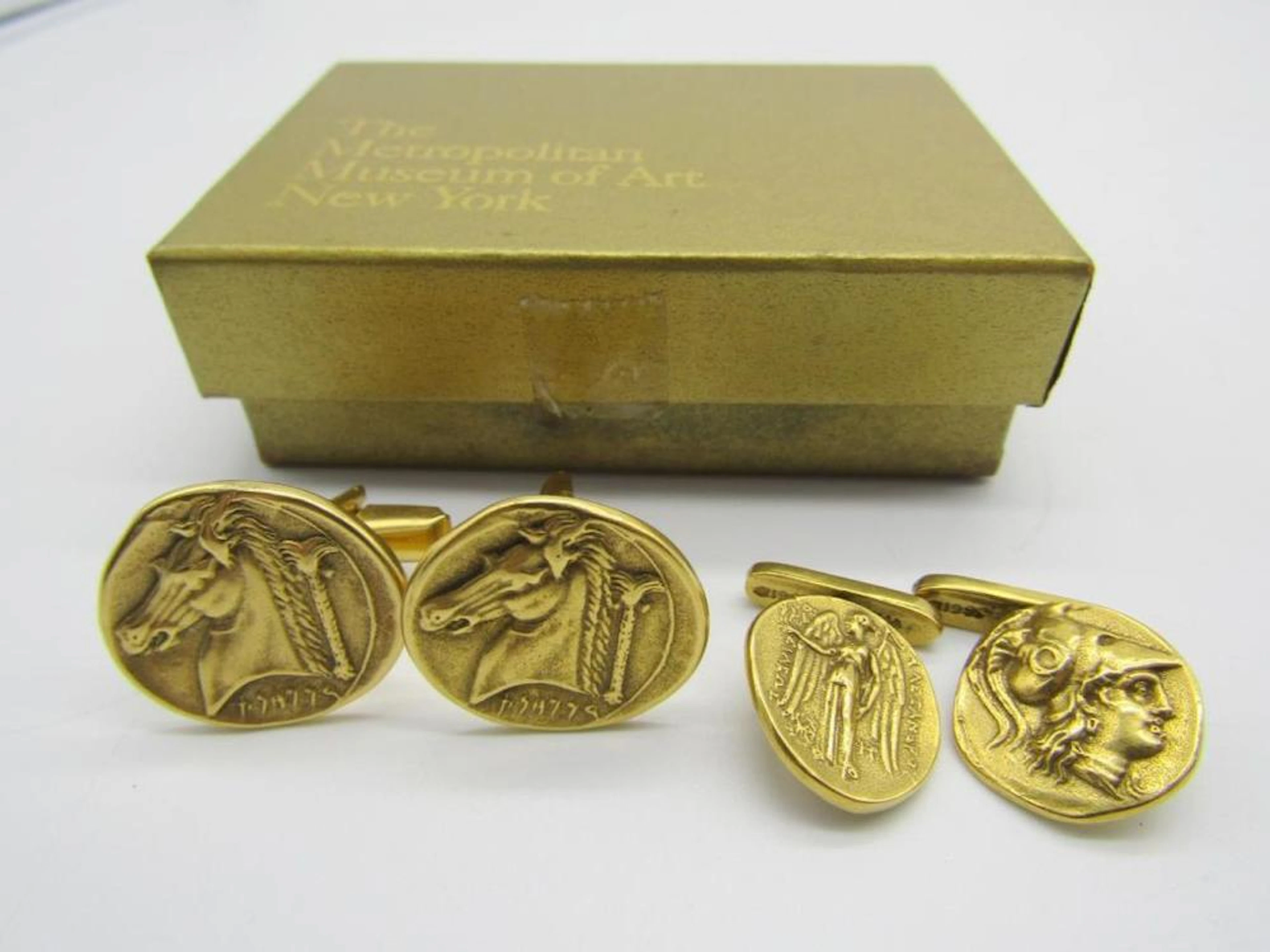 Two pairs of MMA 24kt gold plated cufflinks