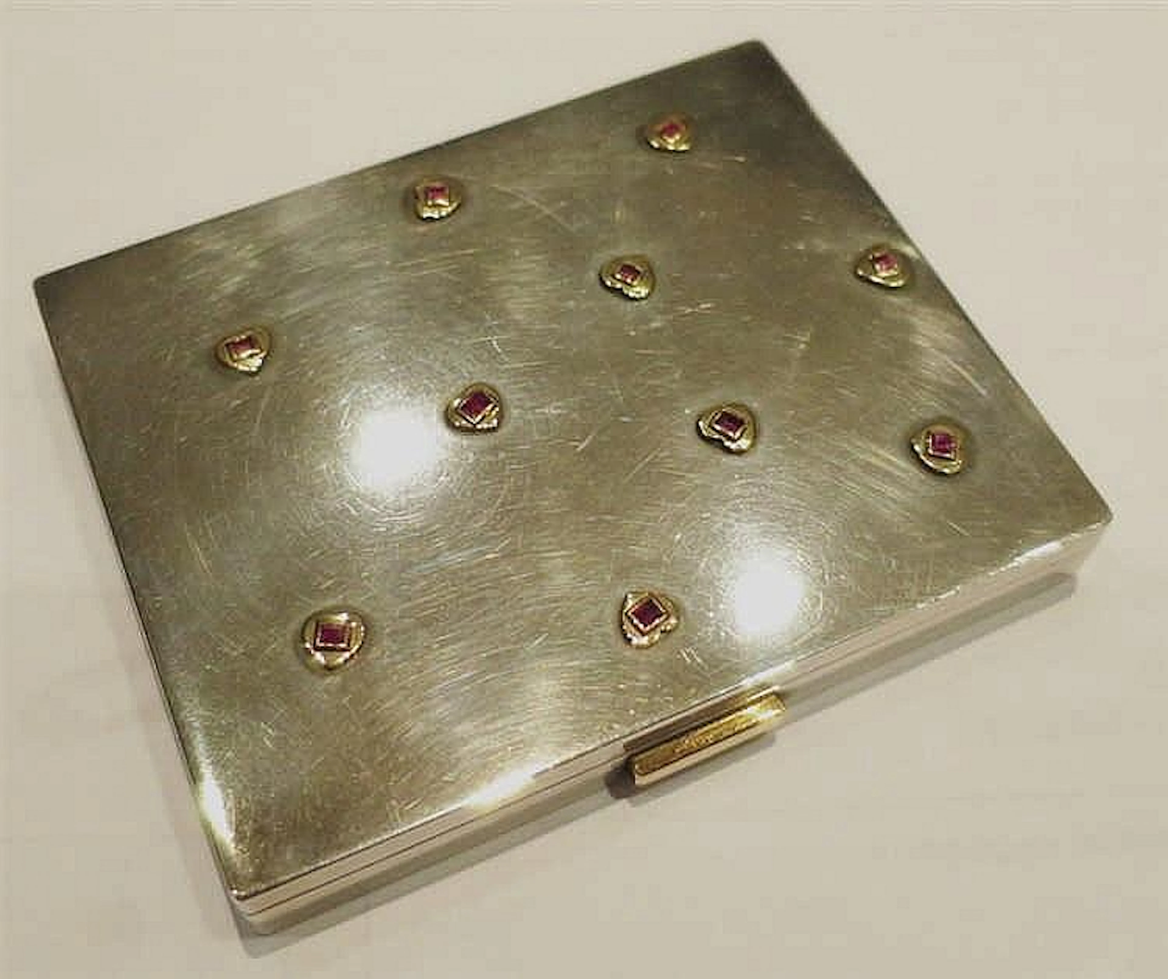 CARTIER - TROUSSE IN ARGENTO, ORO E RUBINI