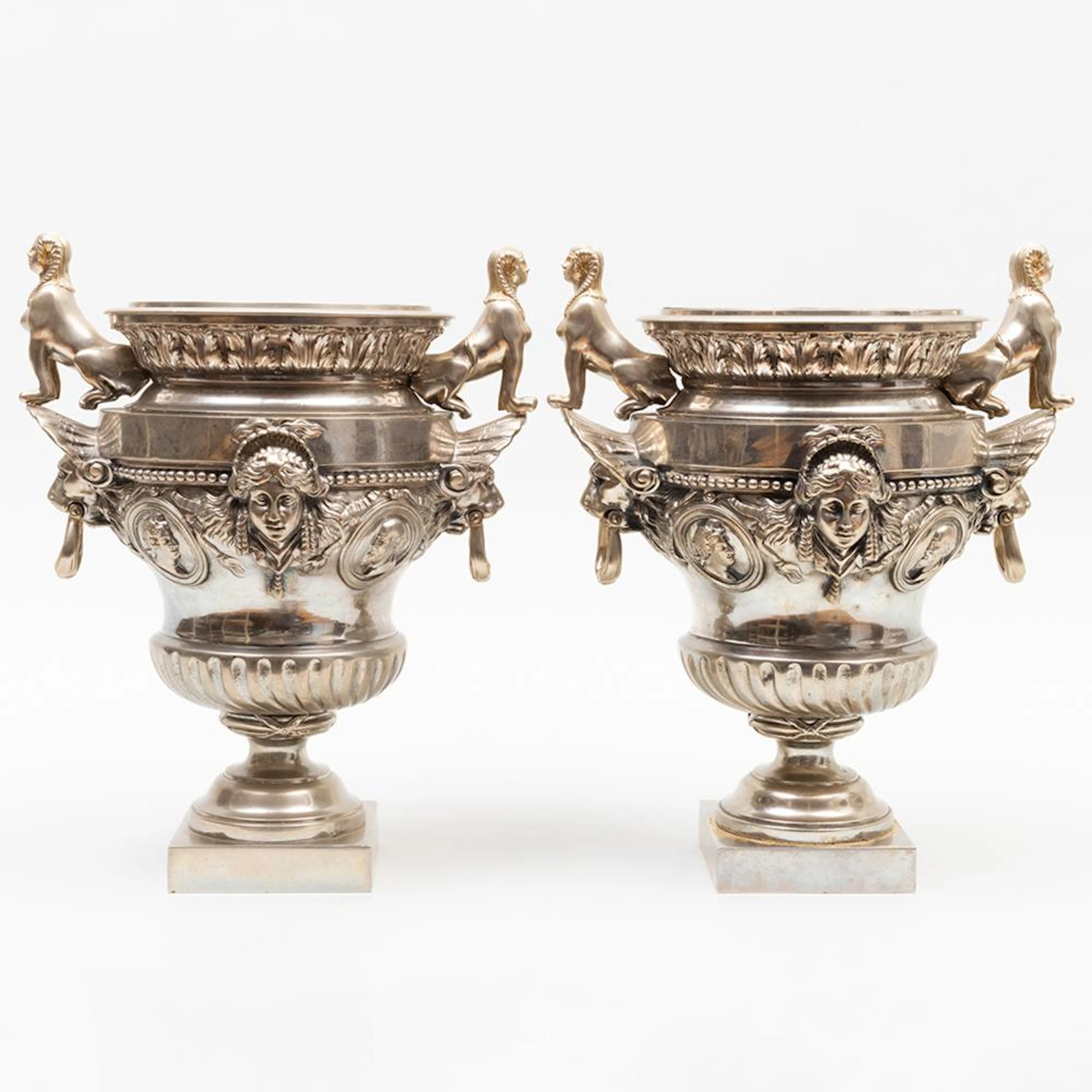 Pair of Napoleon III Silvered-Metal Urns with Sphynx Handles