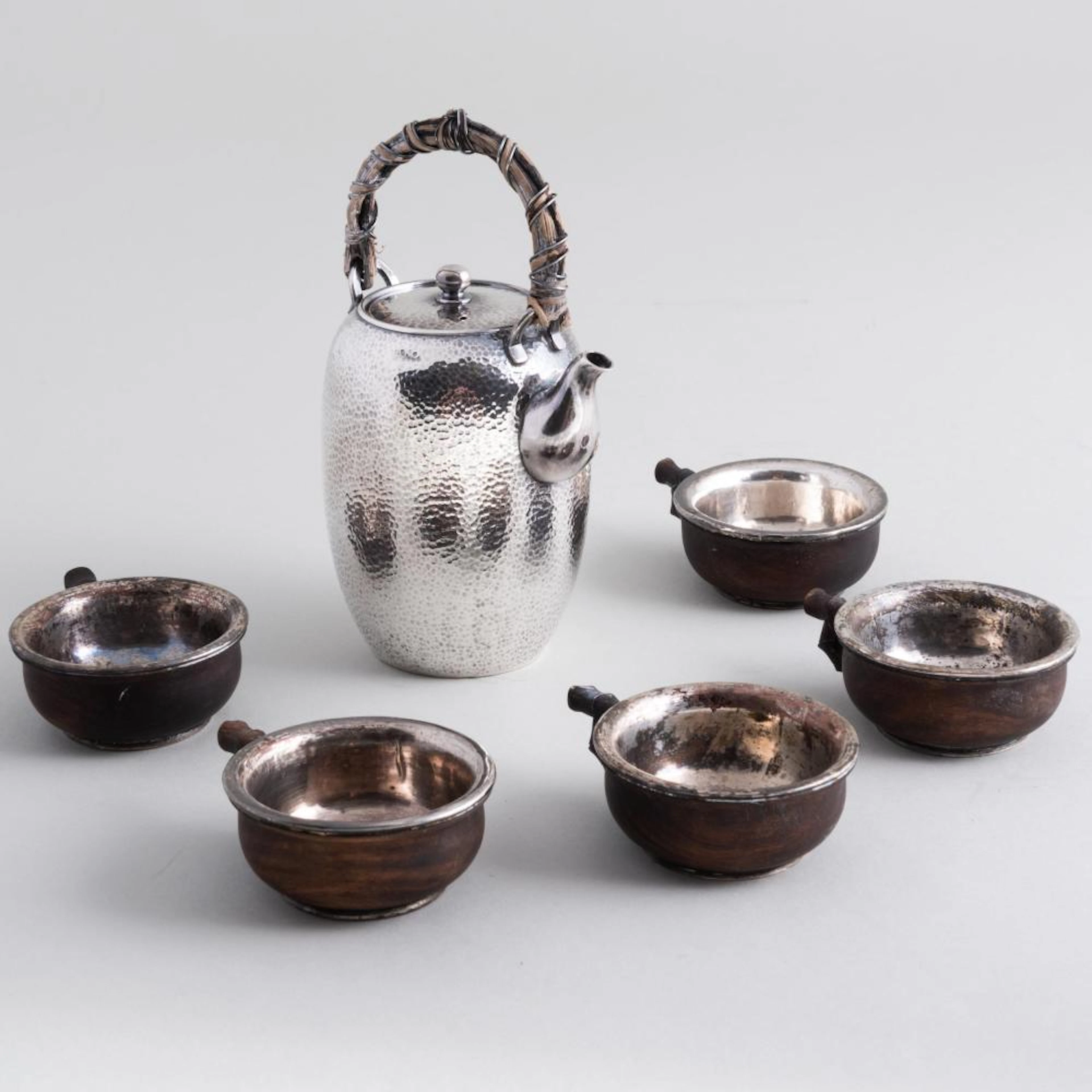 Japanese Hammered Silver Sake Ewer, Five Wood Sakazuki and a Lacquer Tray