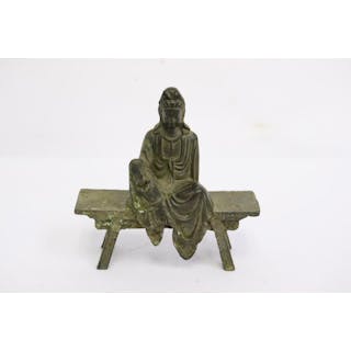A small bronze sculpture of deity