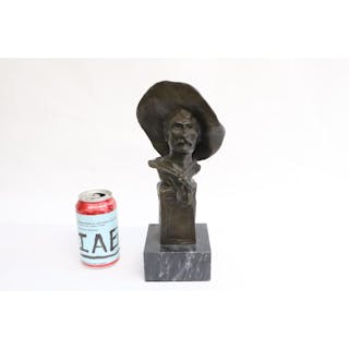 Bronze sculpture of cowboy bust on marble stand