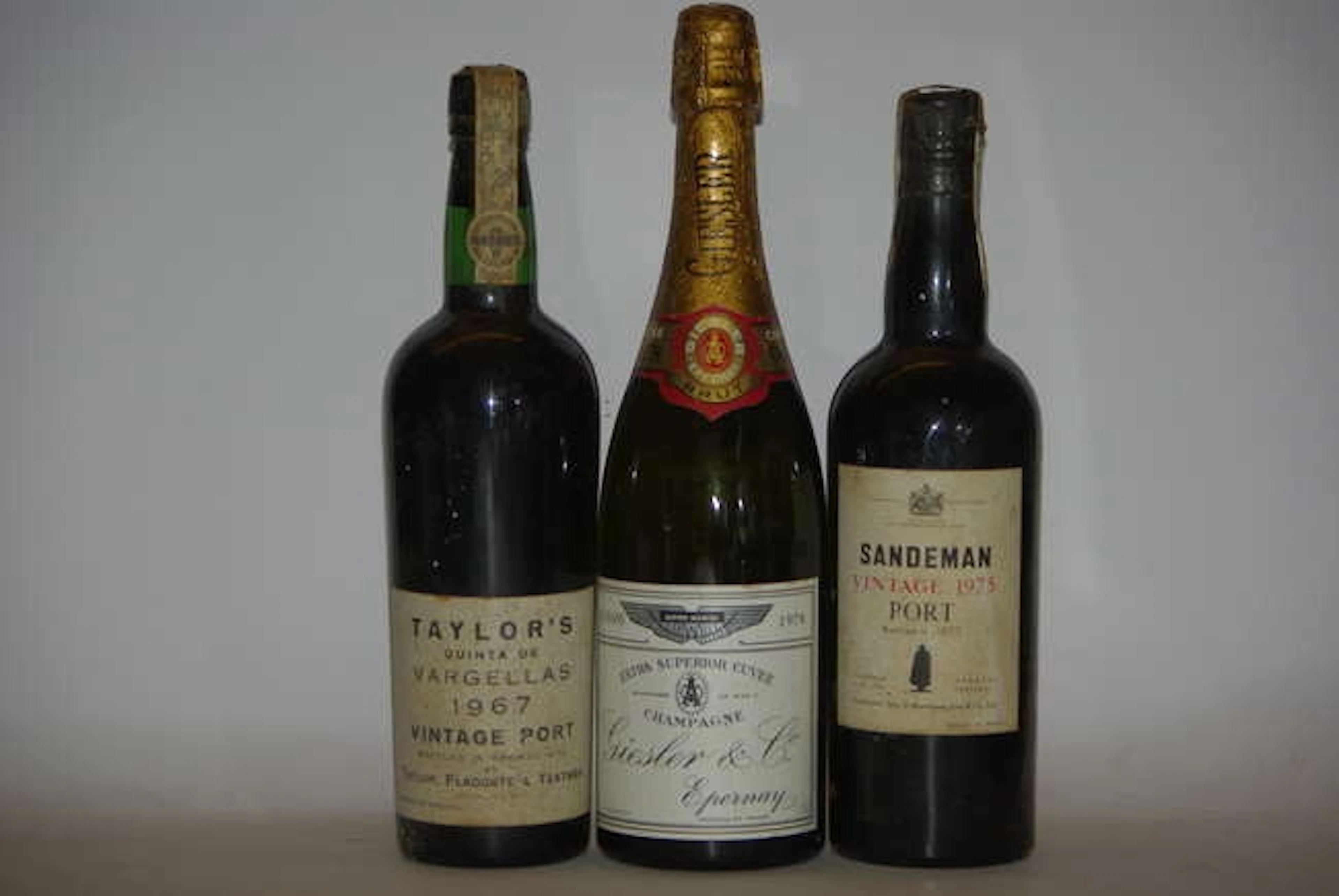 Assorted to include: Taylor's Quinta de Vargelas, 1967, one bottle (low neck); Sandeman, 1975, one ...