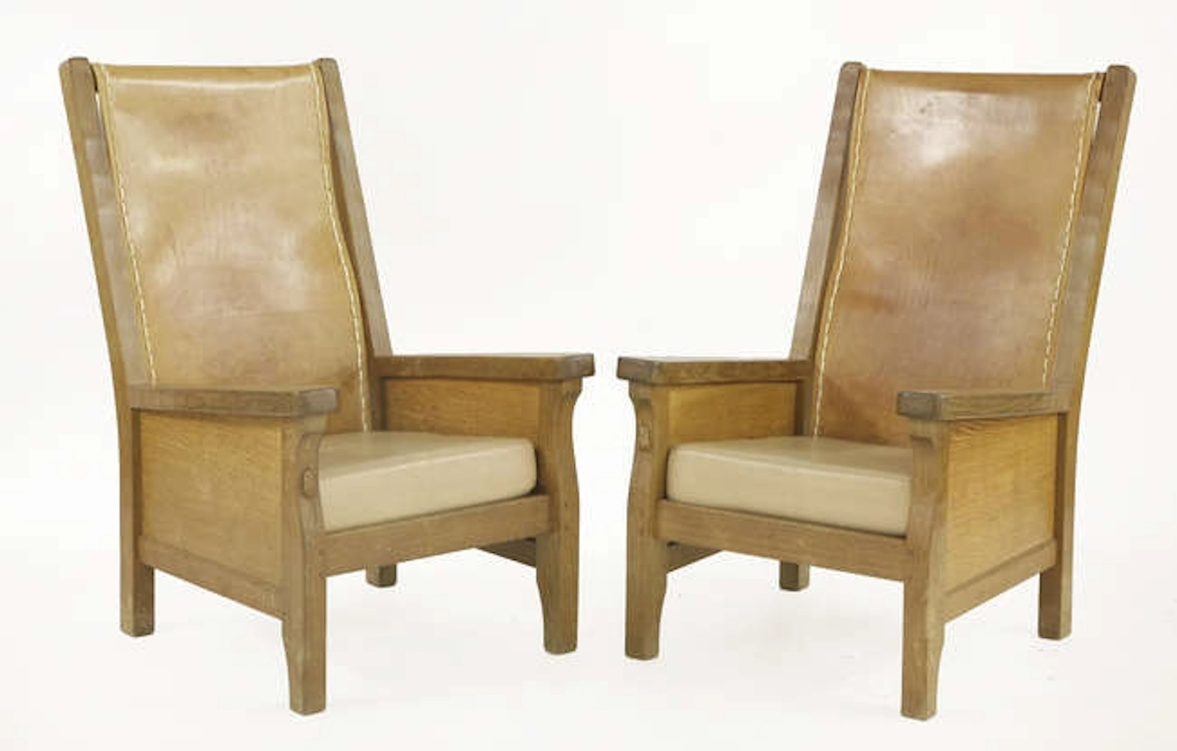 A pair of Robert 'Mouseman' Thompson oak smokers' chairs