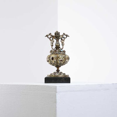 A small gilt-brass urn