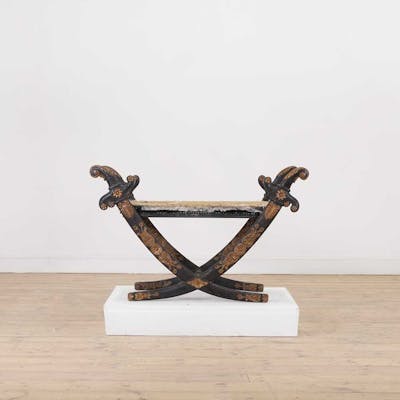 A Regency-style ebonised and parcel-gilt stool
