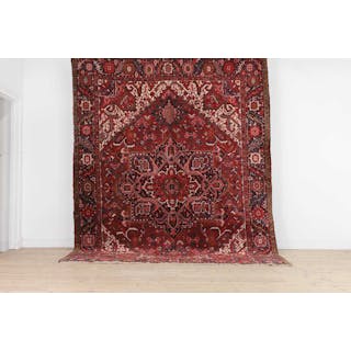 A Persian Heriz wool carpet