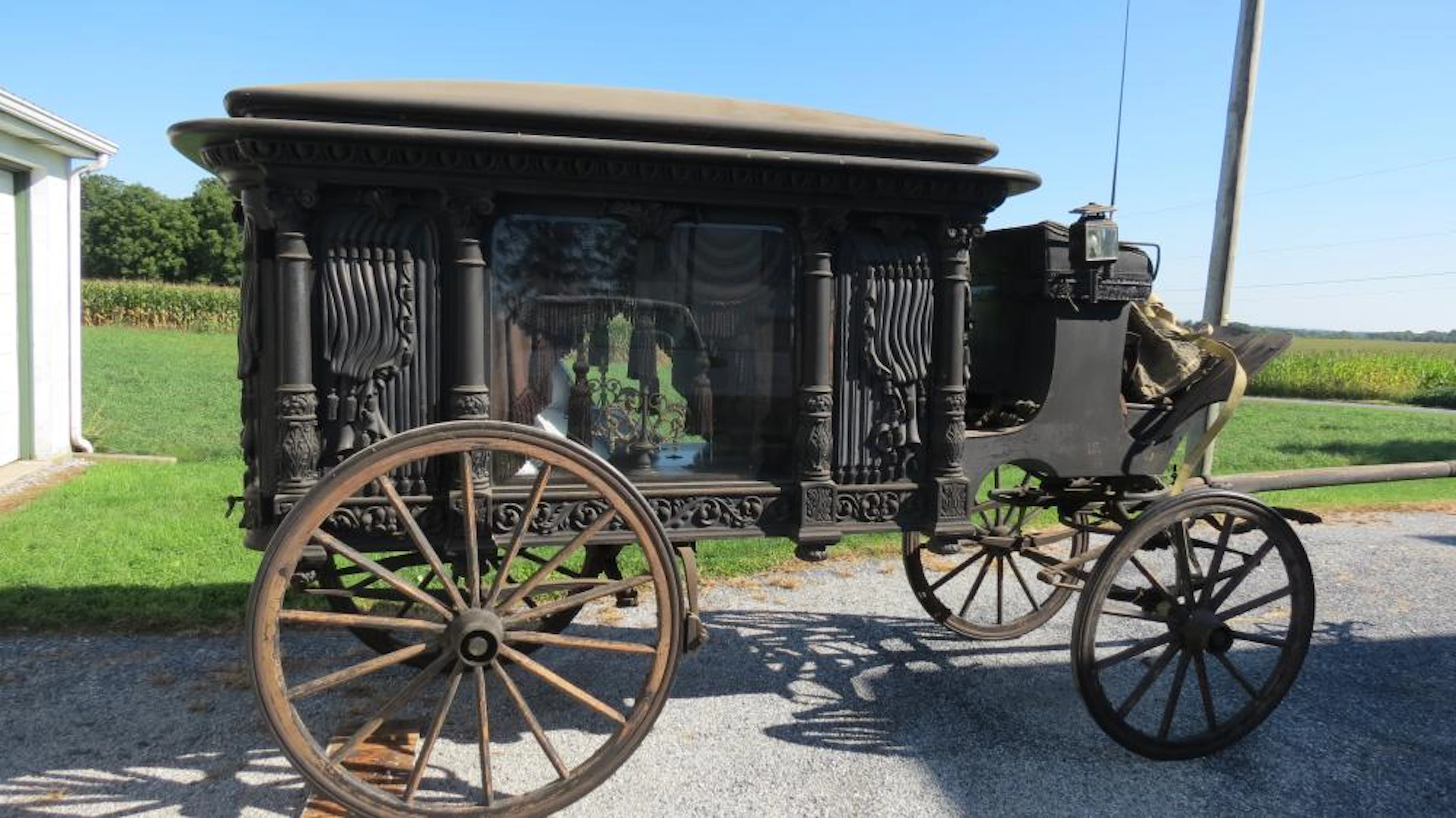 Beautifully hand-carved wooden horse-drawn hearse