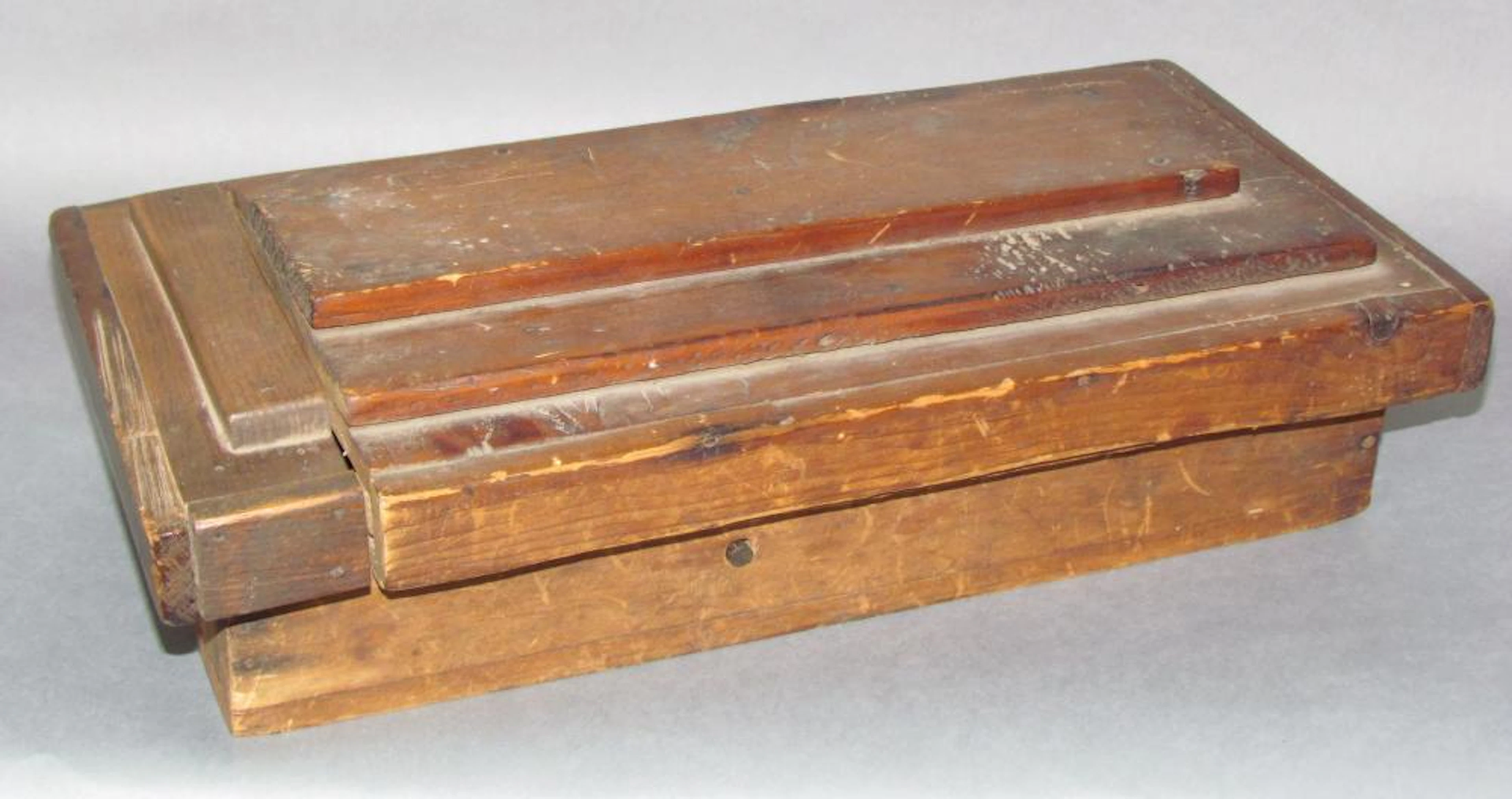 Comical folk art carved man slide lid box