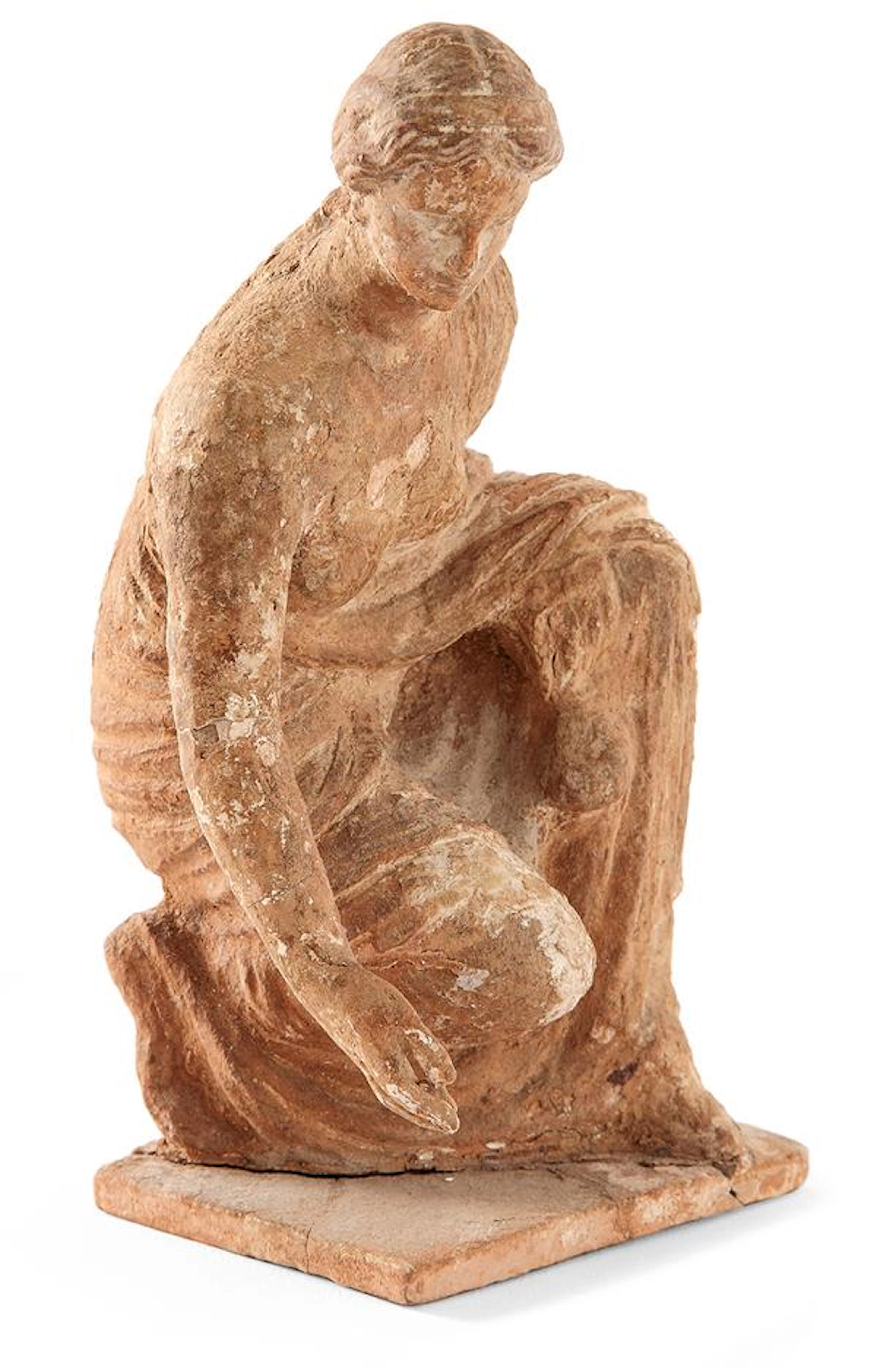 STATUETTE VOTIVE REPRÉSENTANT UNE FEMME ACCROUPIE JOUANT AUX