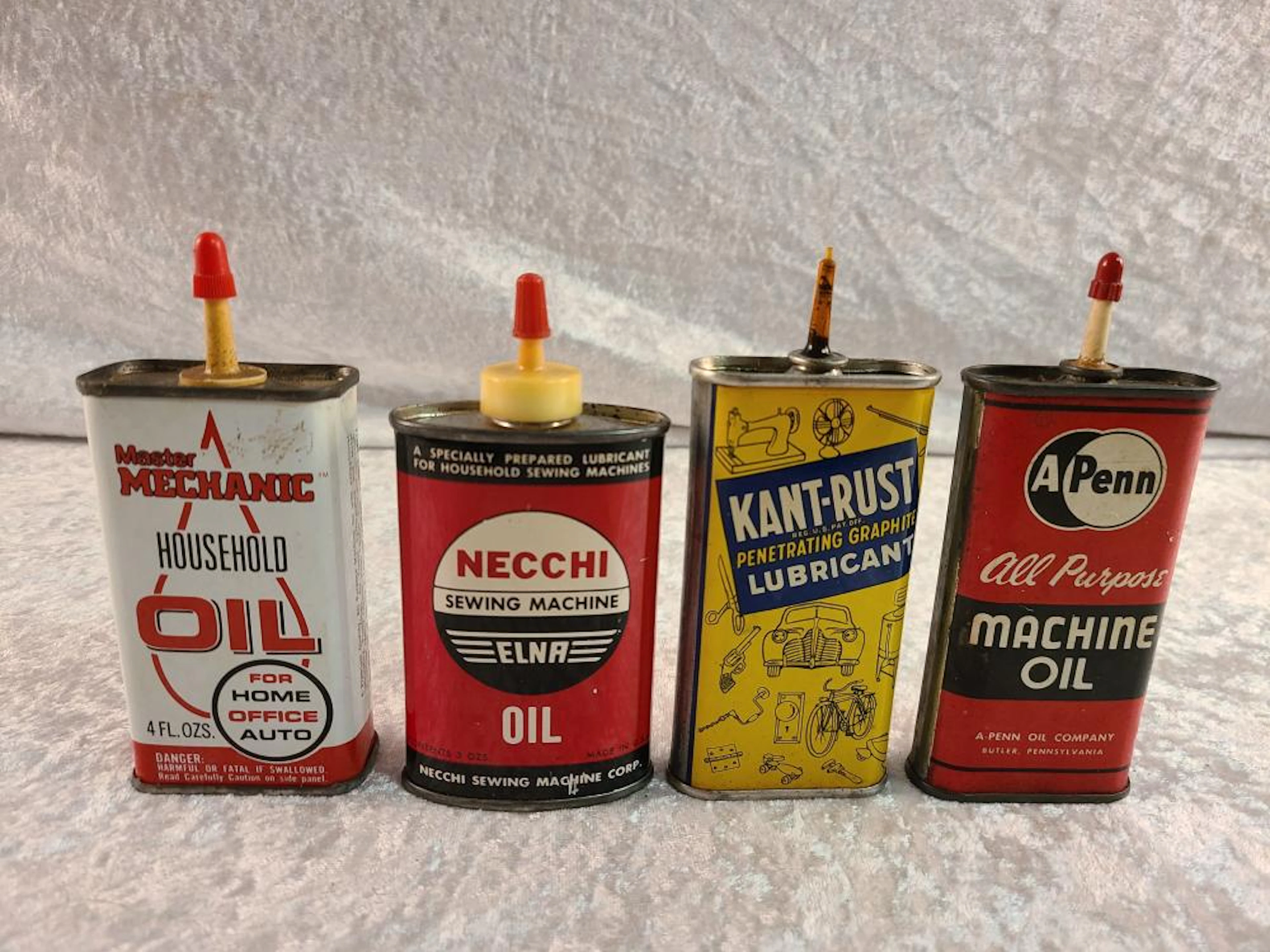 (4) Vintage Oil Cans with Plastic Tops
