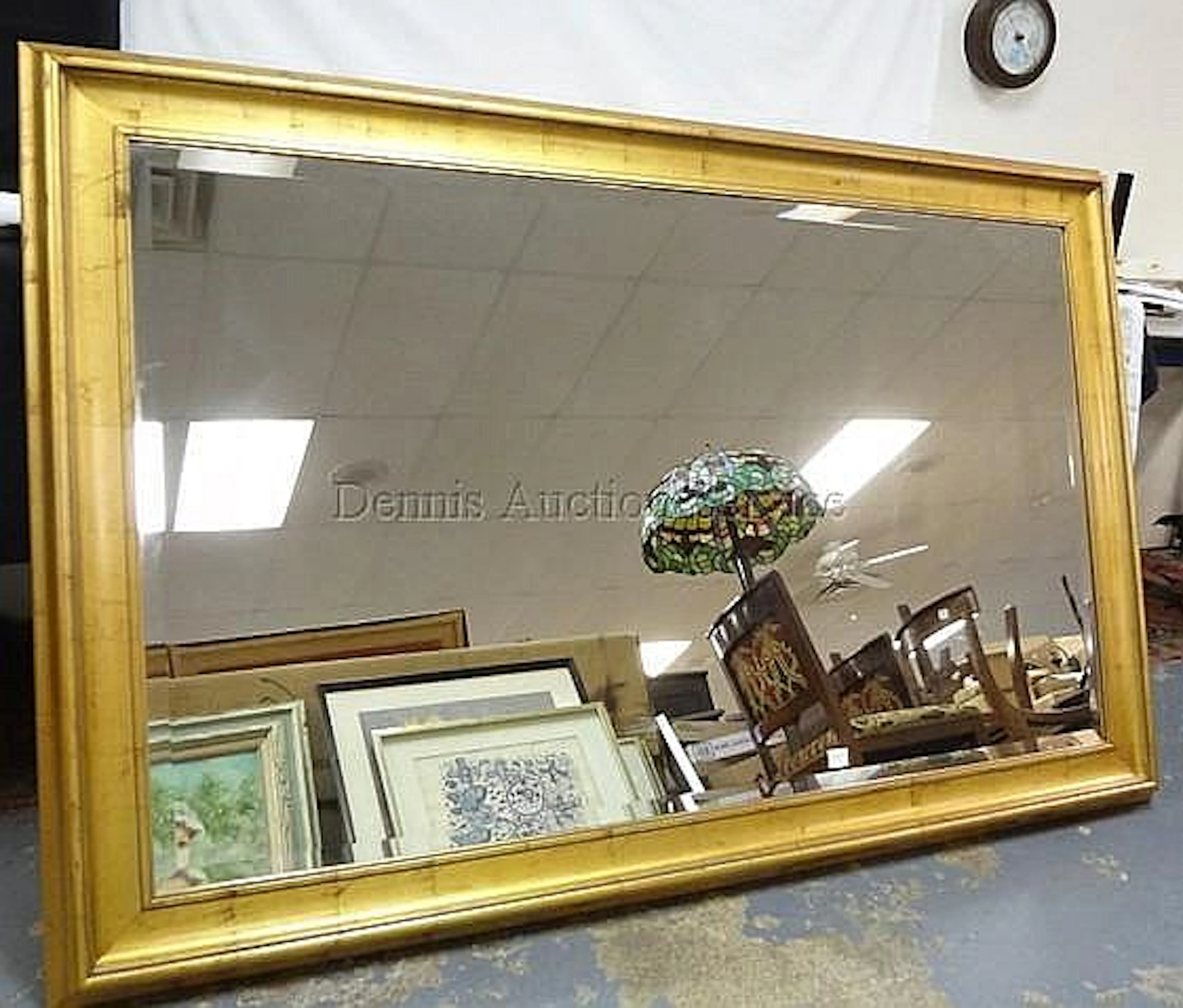 LARGE BEVELLED MIRROR IN GOLD FRAME; 69 IN X 45 IN OVERALL