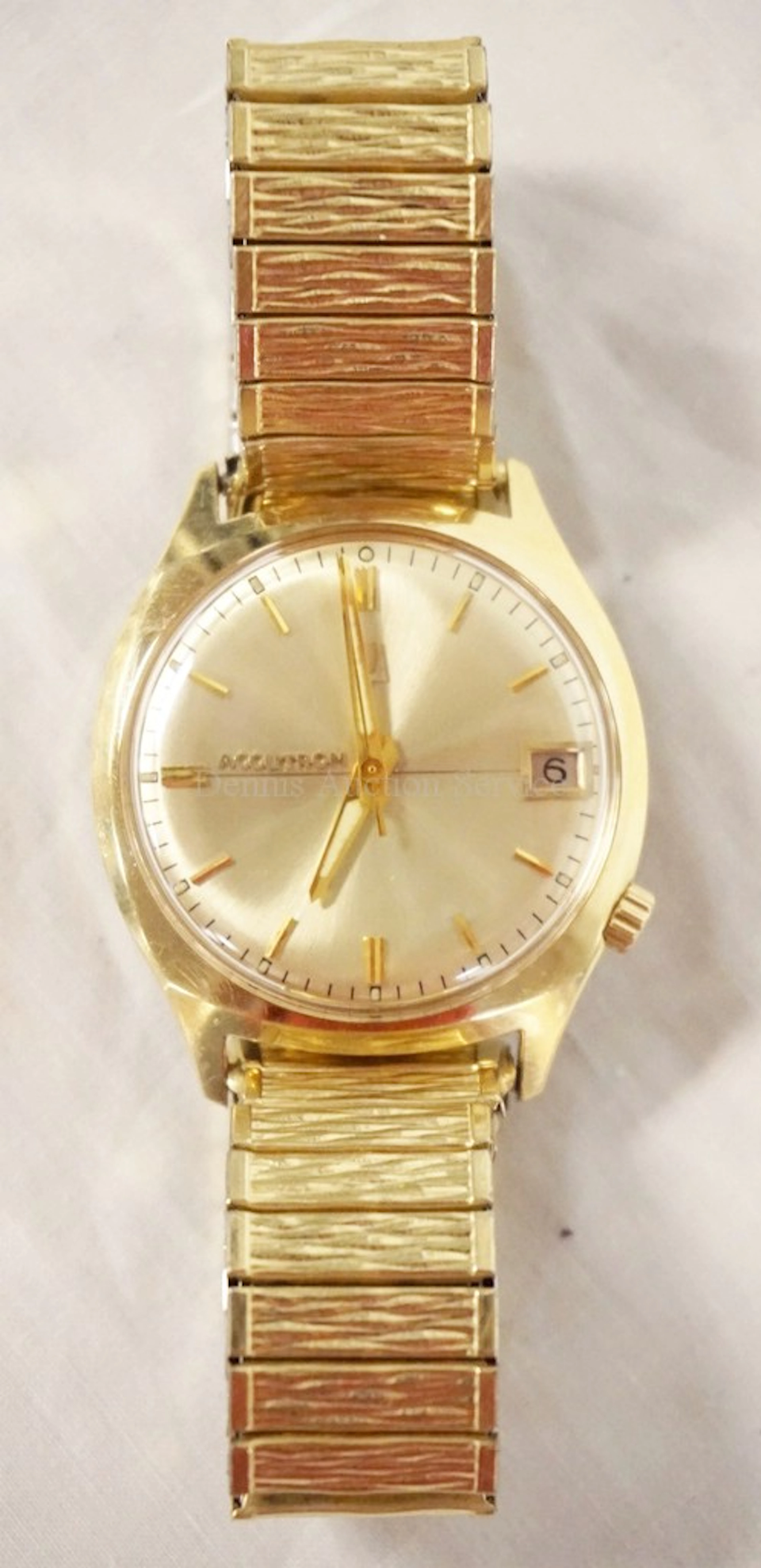 14K GOLD BULOVA ACCUTRON WRIST WATCH WITH A 10K GOLD FILLED BAND.