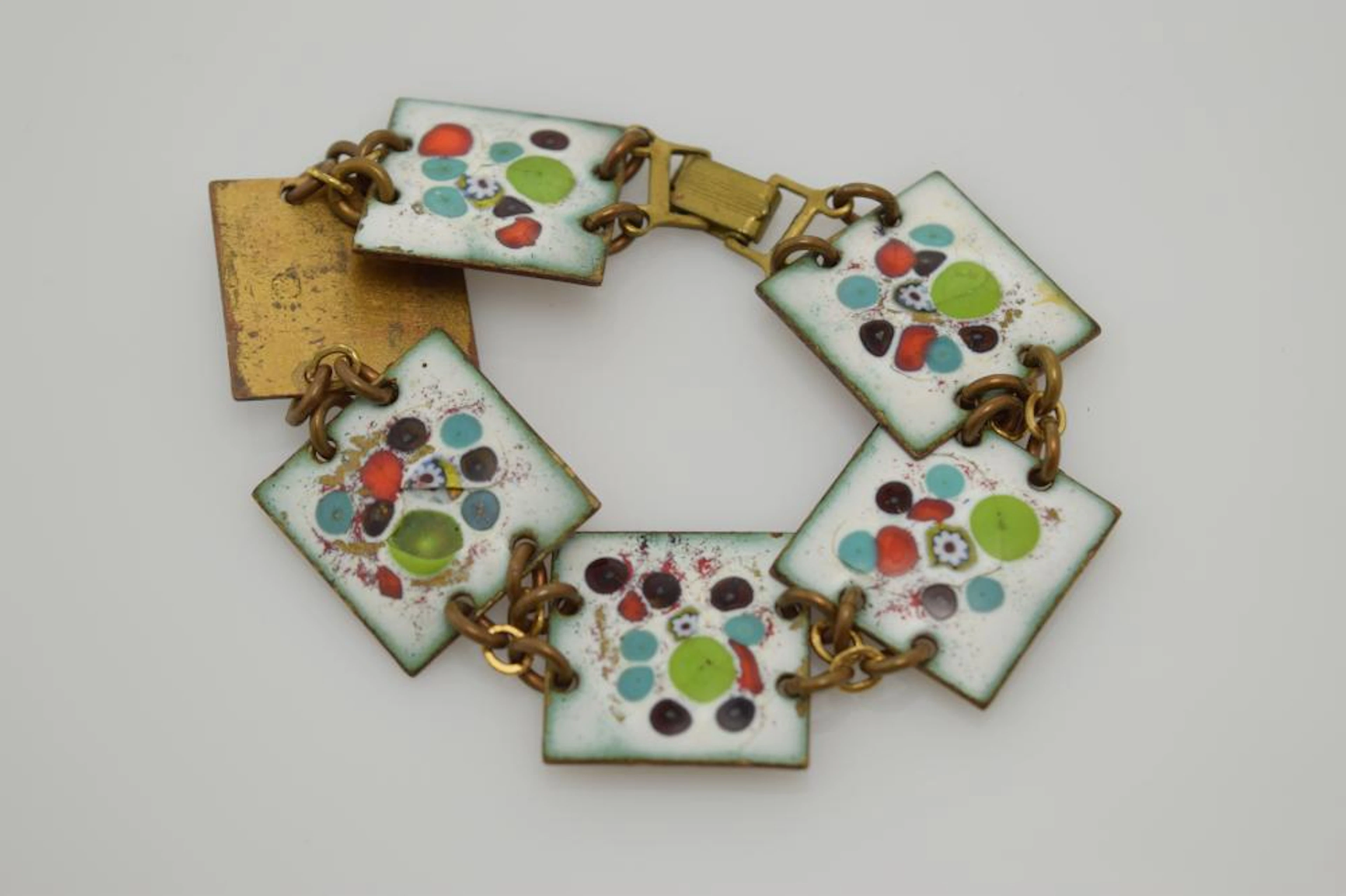 An enamel over brass bracelet.