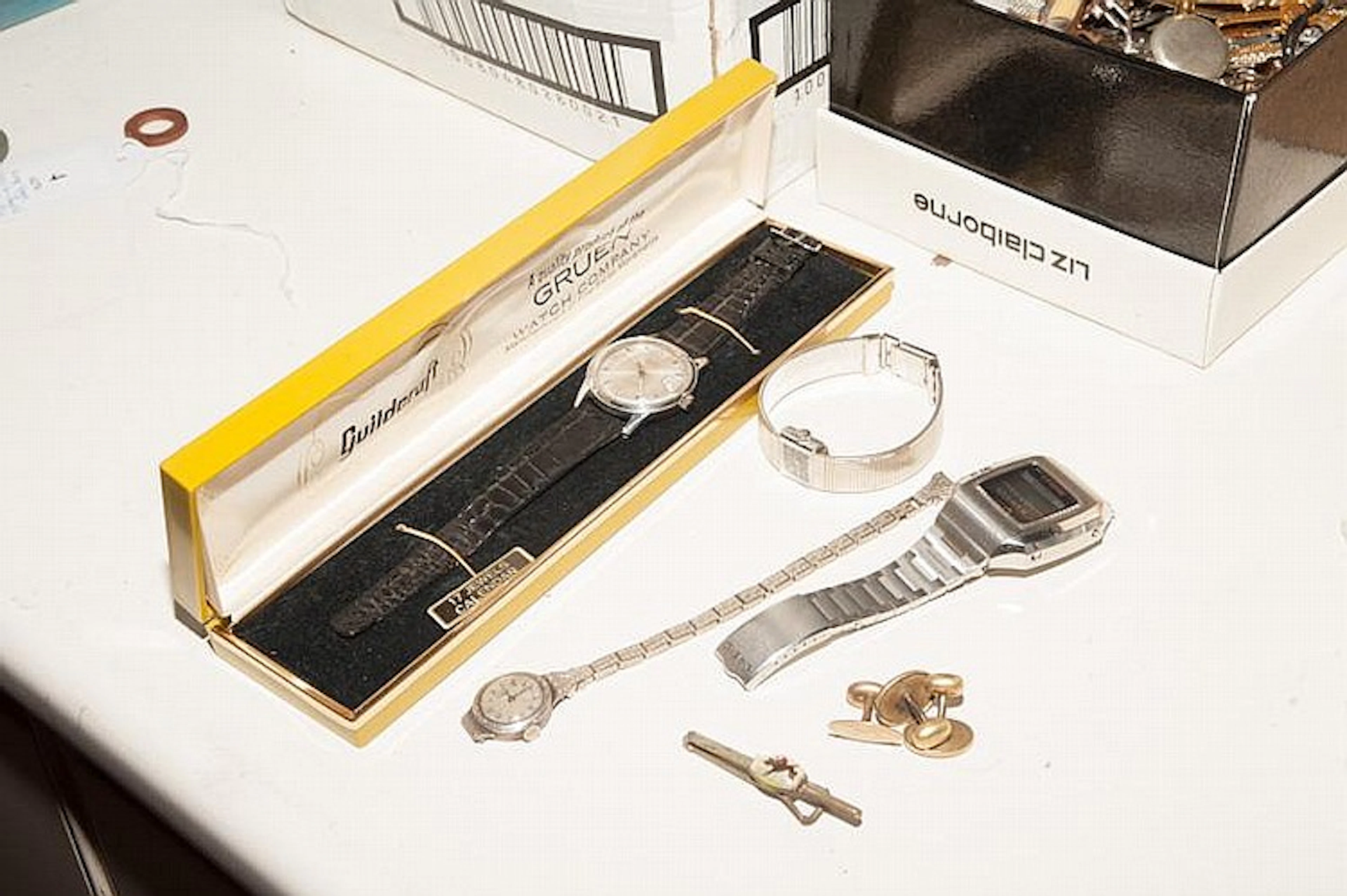 OMEGA & CASIO FOR TIFFANY & CO. WATCHES AND CUFFLINKS ETC LOT. This lot includes: (1) Casio Tiffany & Co. digital quartz watch. (1) Ladies Bucherer minimalist wrist watch. (1) Antique 900 silver-cased
