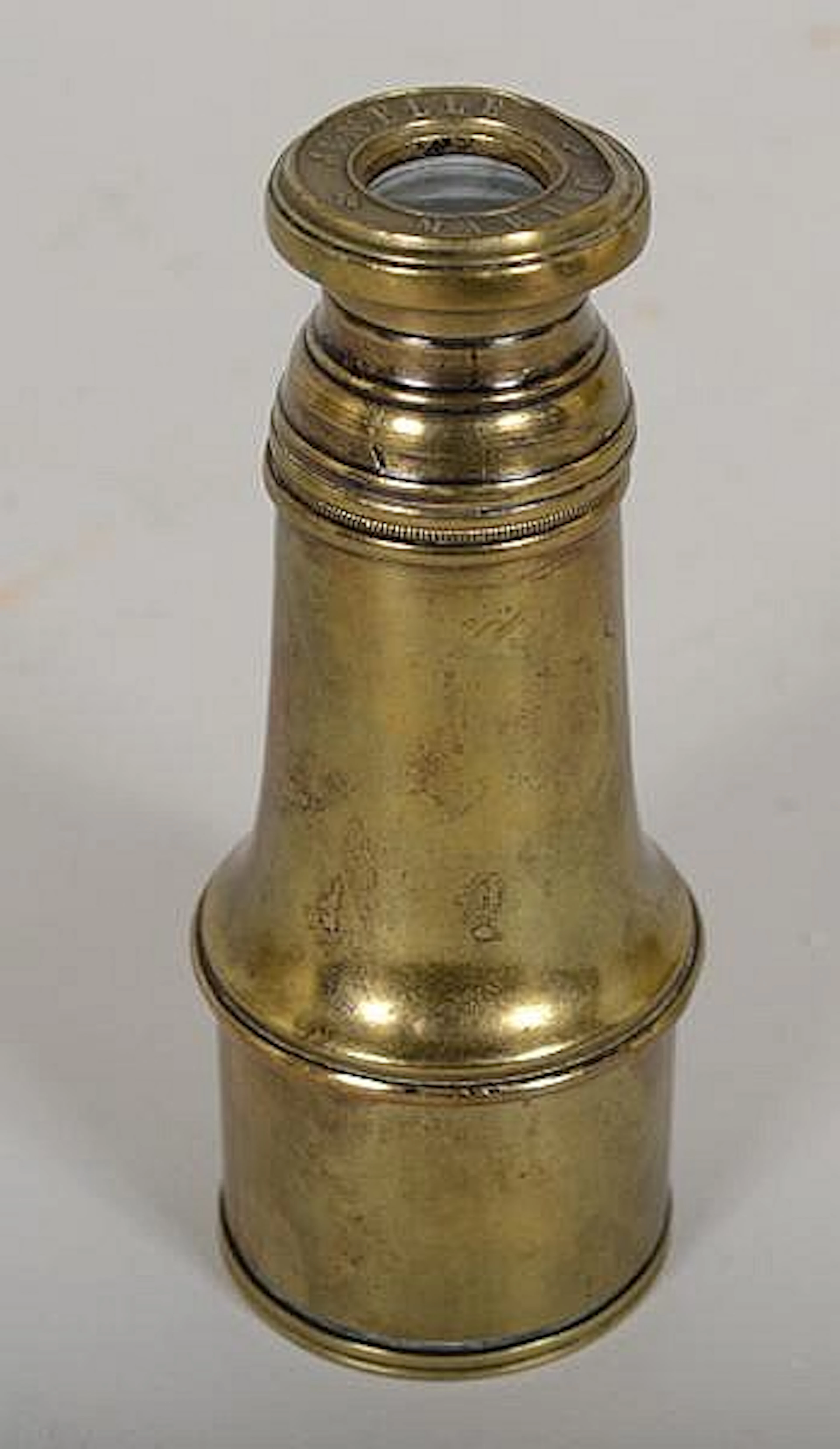 VINTAGE BRASS SPY GLASS. Vintage brass telescoping spy glass. Marked: Jumelle Marine. Size; extends 5 1/2'' - 6 1/2''. 2''Diam. front. Condition: dings and dents