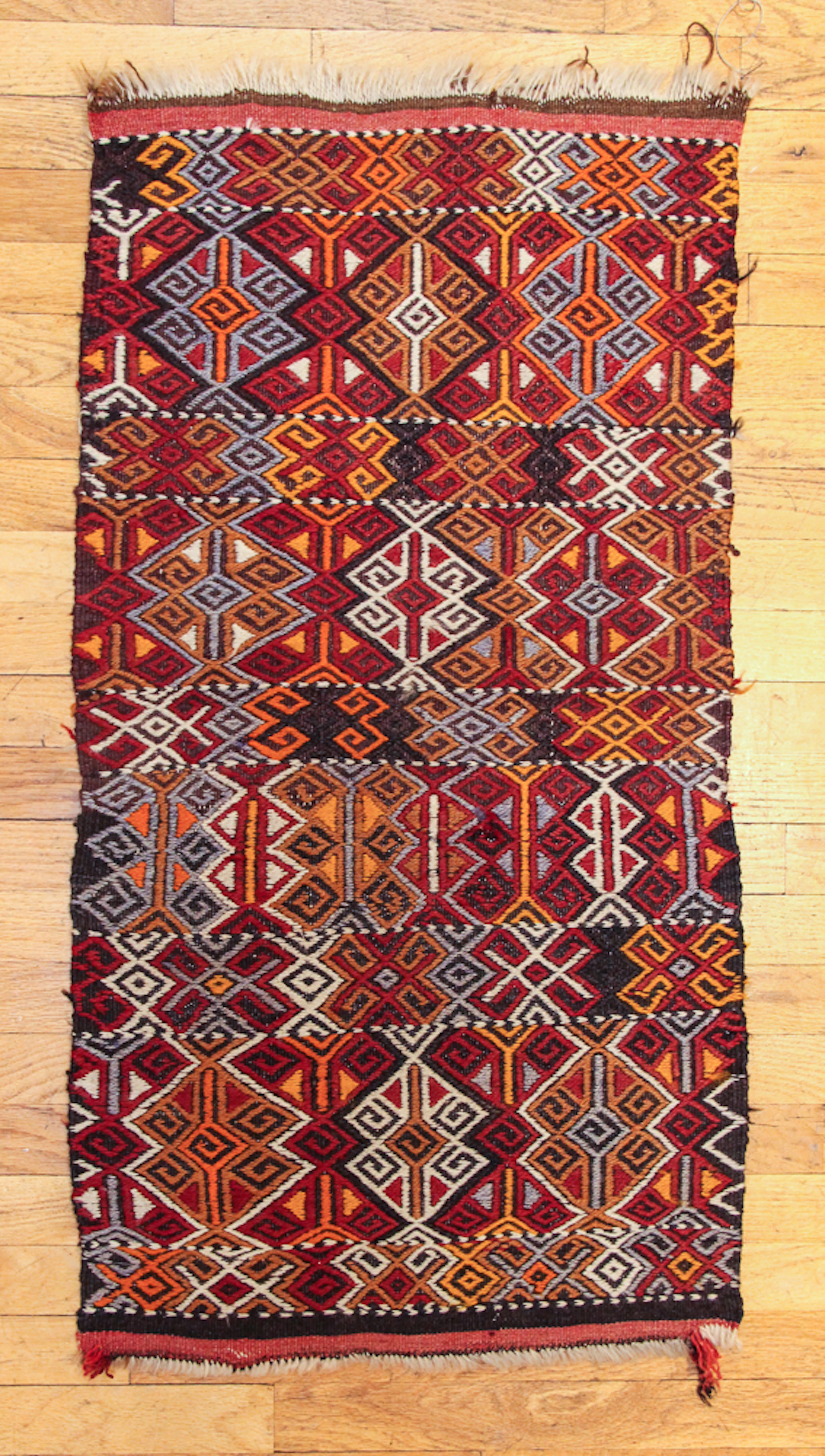 Two Oriental Carpets with Geometric Medallion Patterns