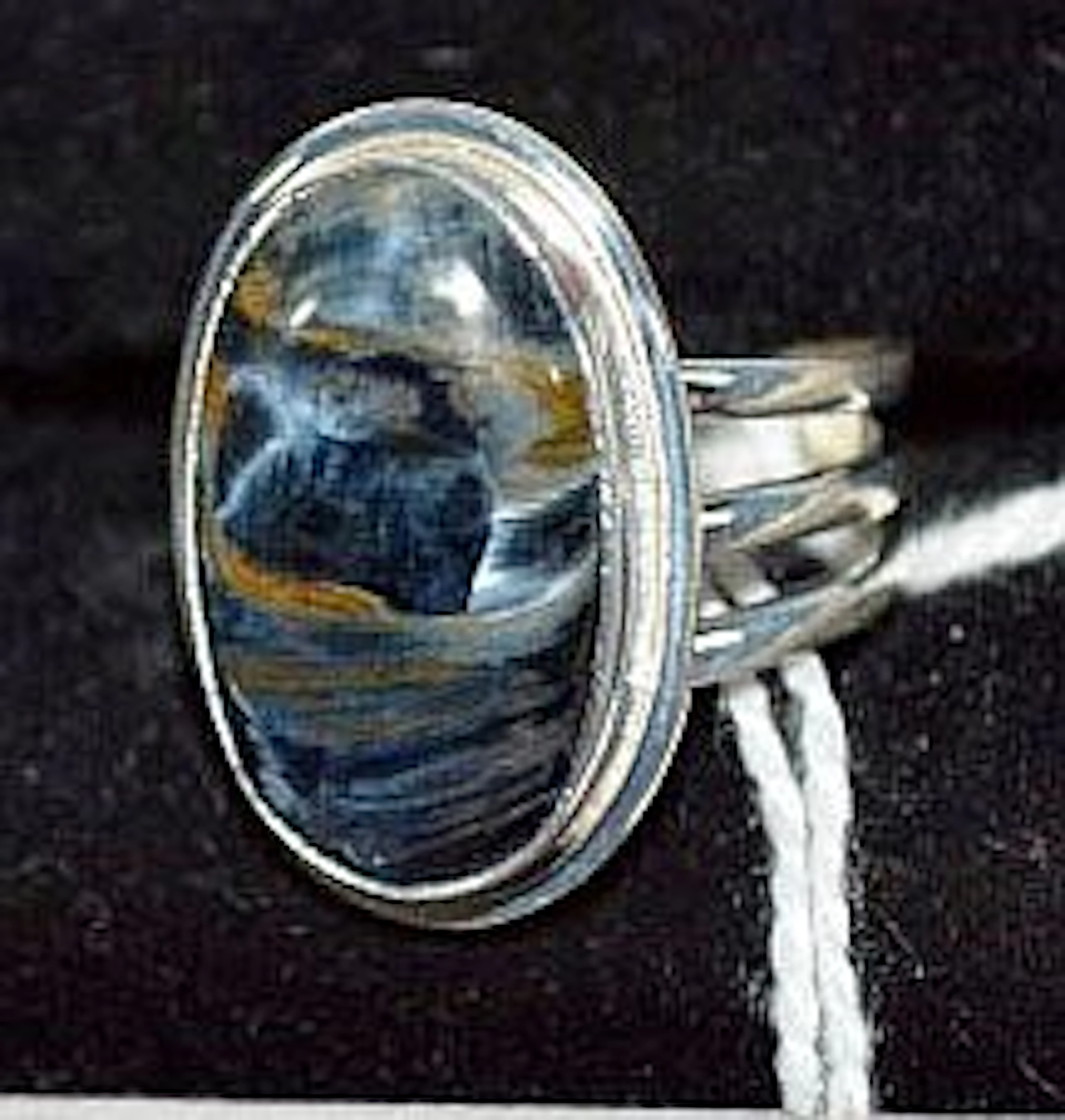 Silver ring set with rare pietersite stone, known