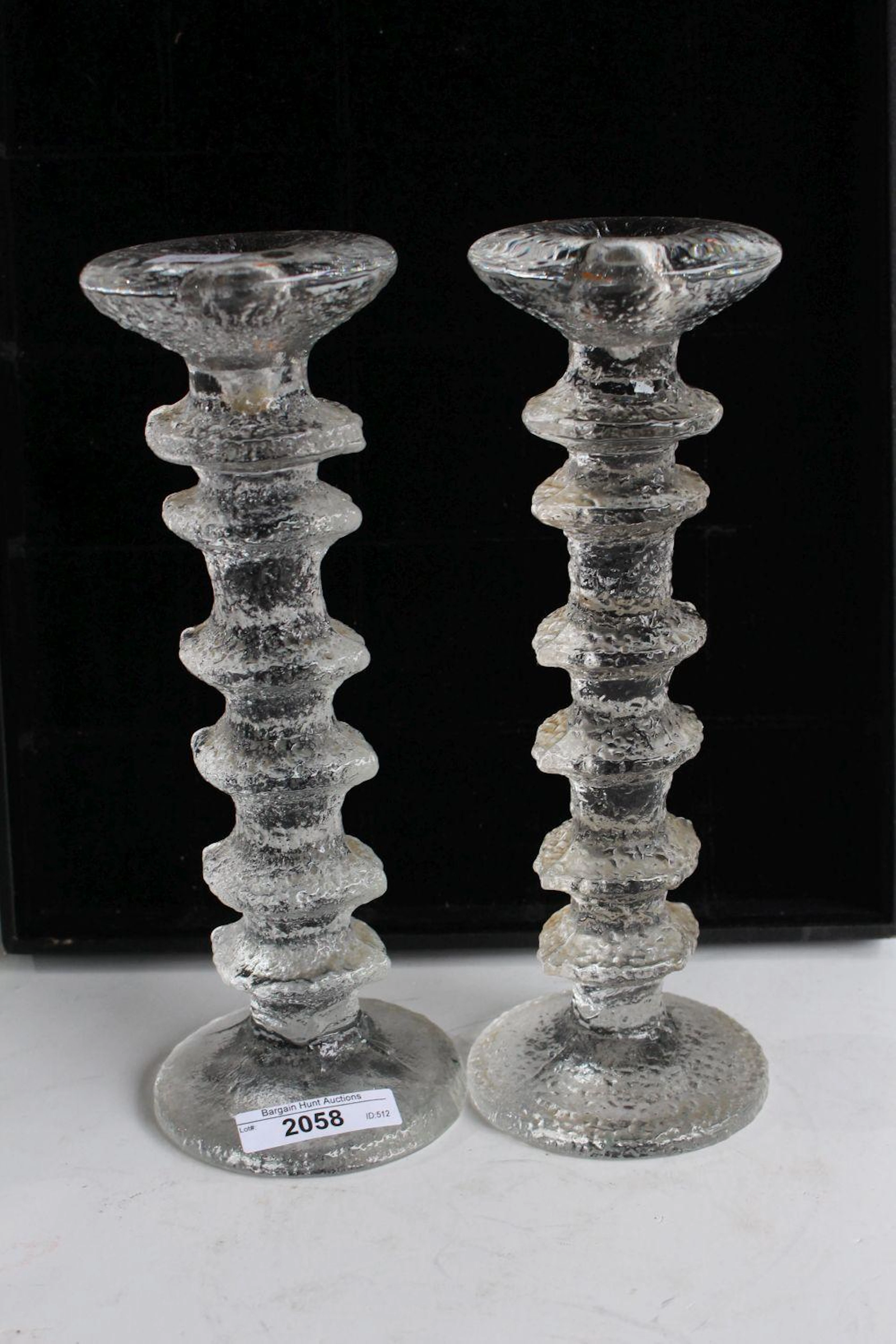 Pair of iittala Festivo candle sticks,