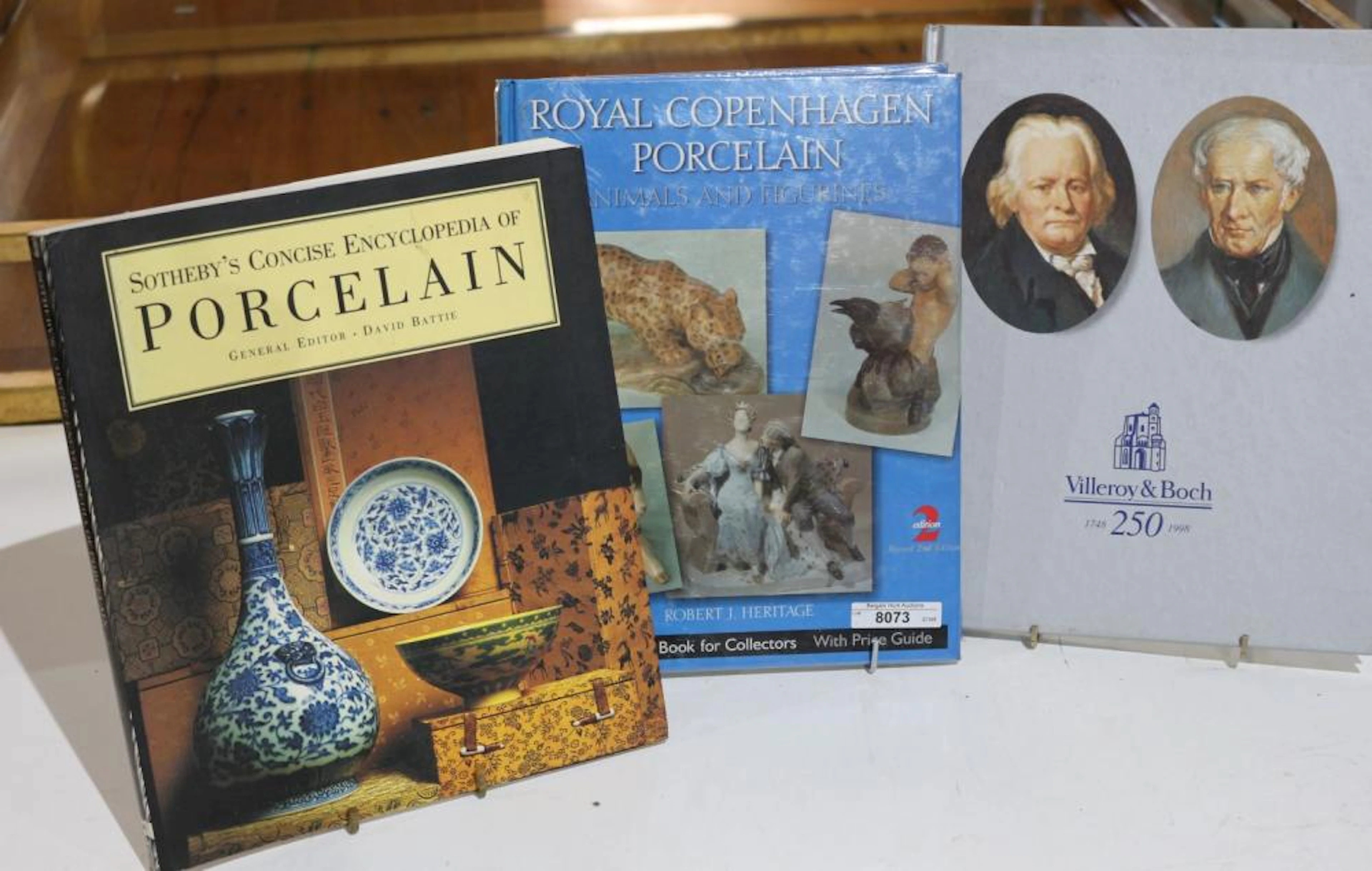 Three porcelain books