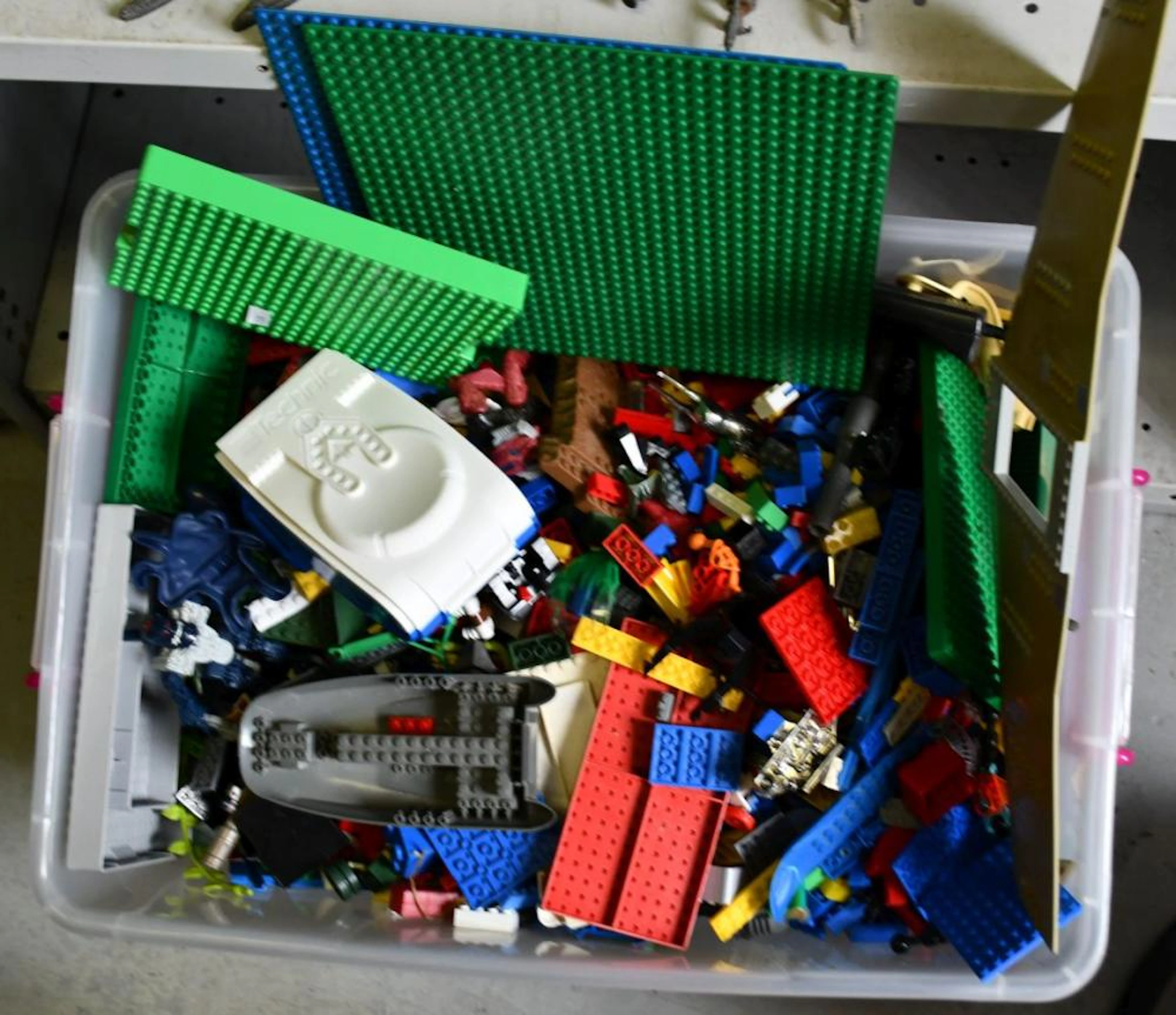 Plastic crate containing Lego and mega bloks