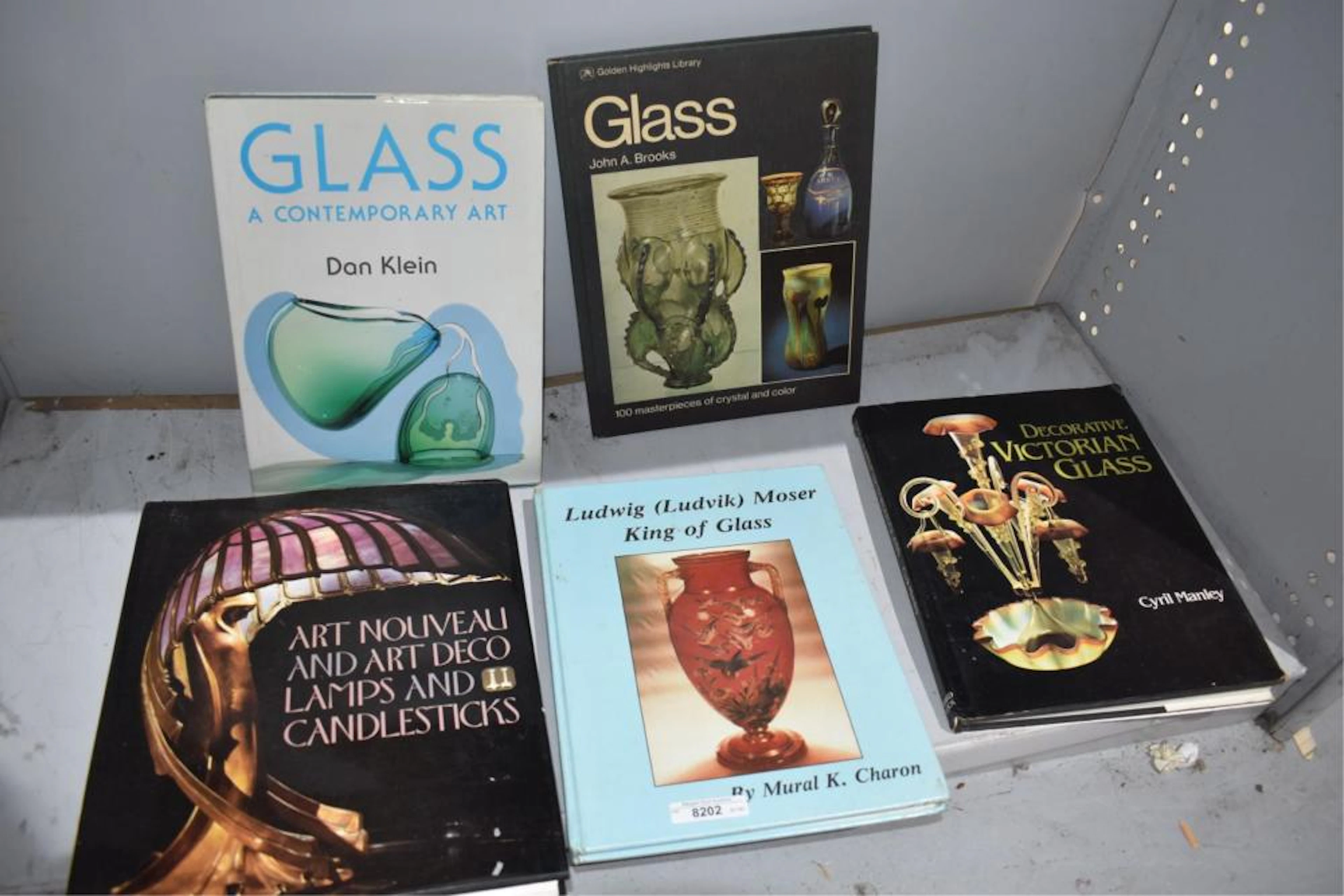 Five hardback antique reference books on glass,