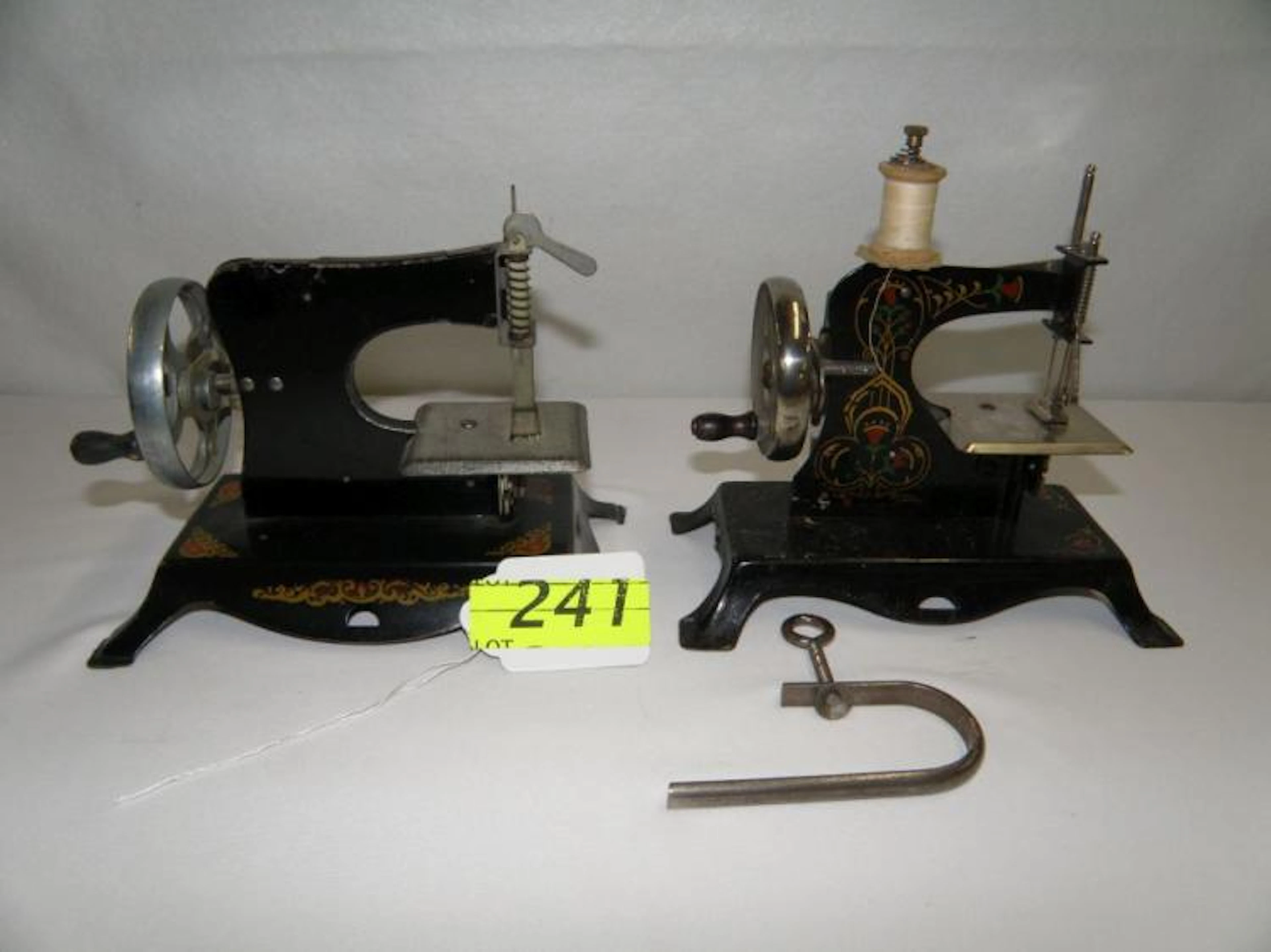 TWO TOY SEWING MACHINES; 1930'S BLACK CASIGE TOY SEWING MACHINE WITH GOLD TRIM