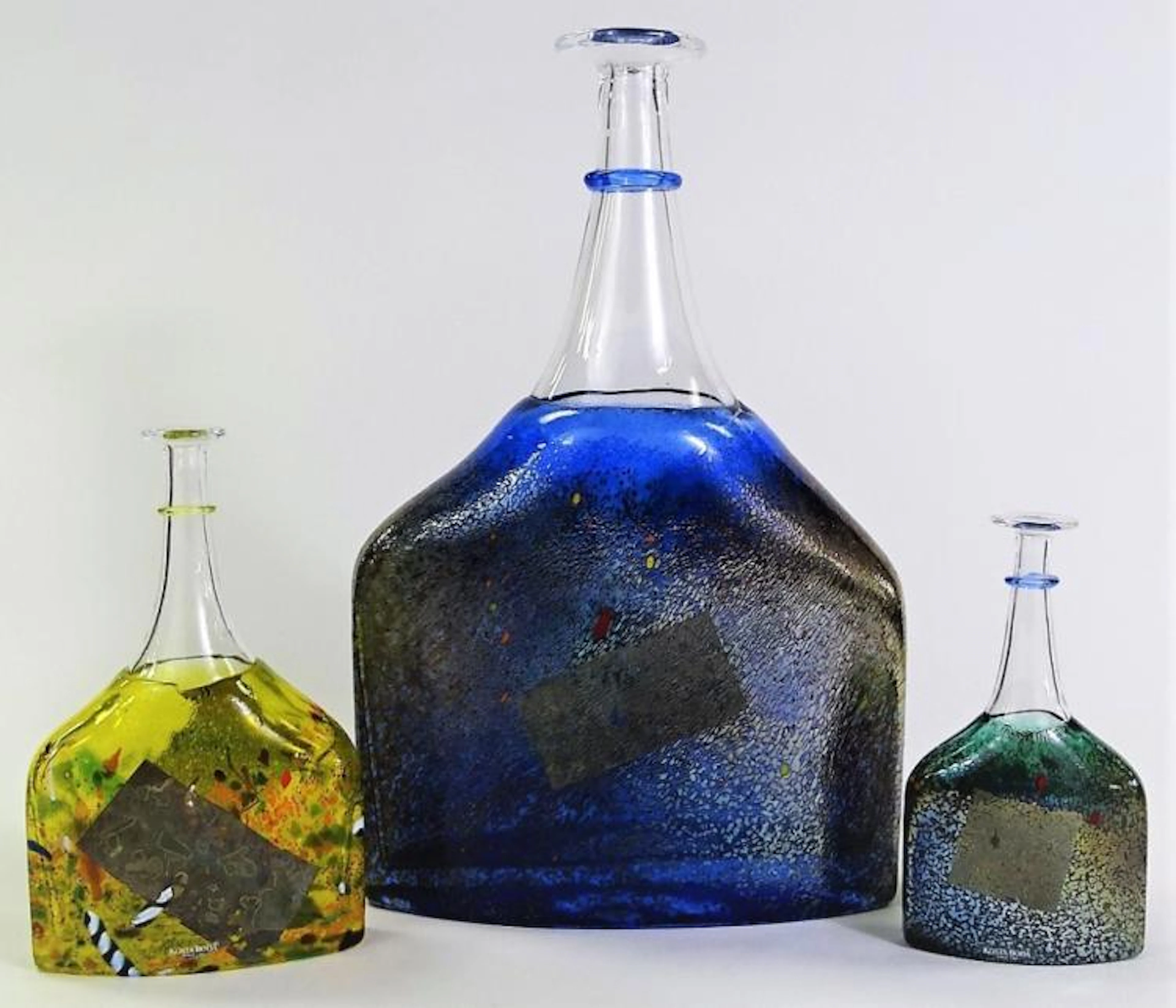 THREE CONTEMPORARY KOSTA BODA BLOWN GLASS BOTTLES